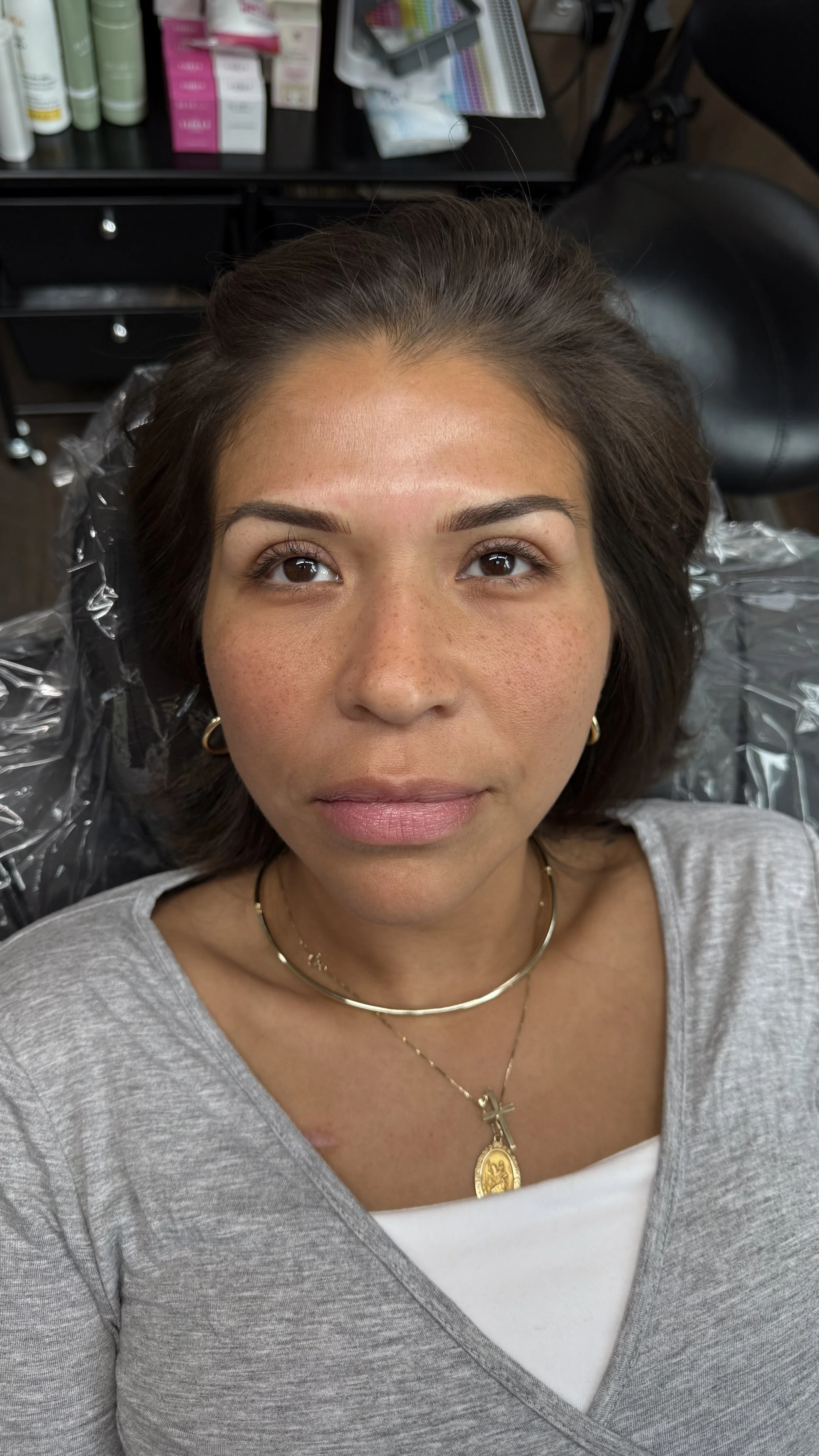 Close-up of a person's eye area showing before and after Permanent Makeup. Powder Brows. Nano strokes. Fairfax permanent makeup artist.