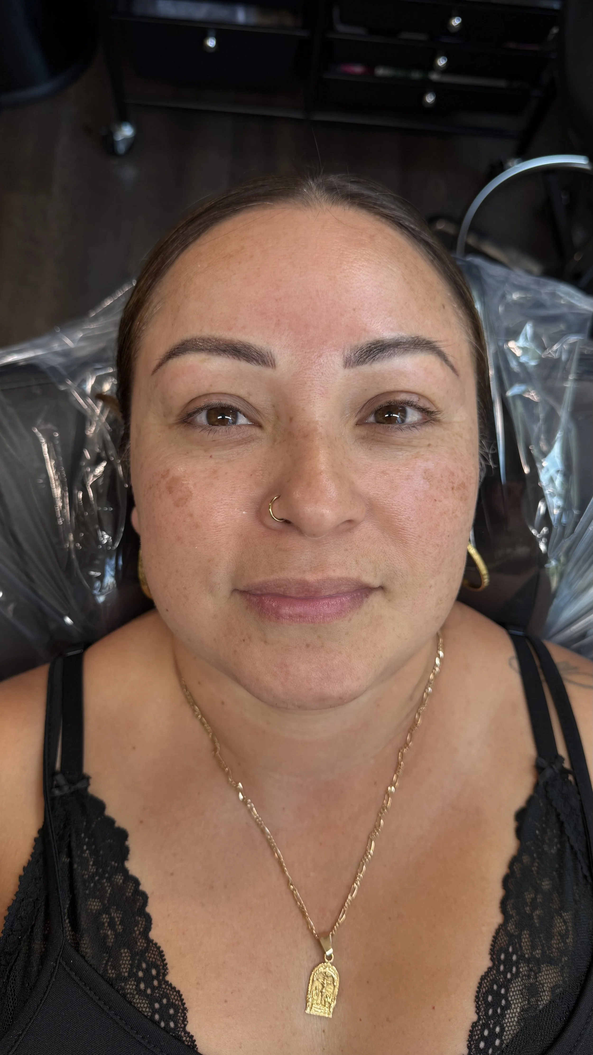 Close-up of a person's eye area showing before and after Permanent Makeup. Powder Brows. Nano strokes. Fairfax permanent makeup artist.