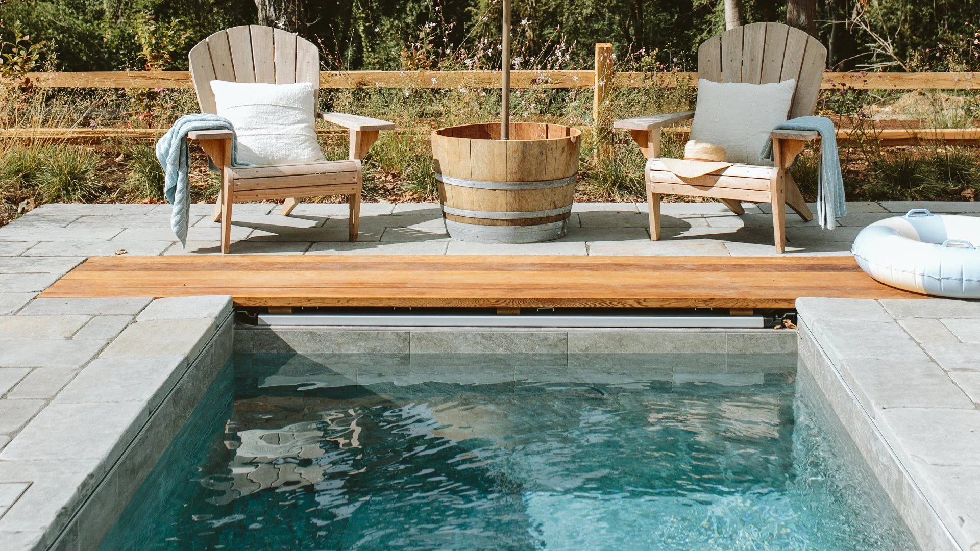 Close-up of Emily Henderson’s hand-tiled Soake Pool with integrated bench seating.