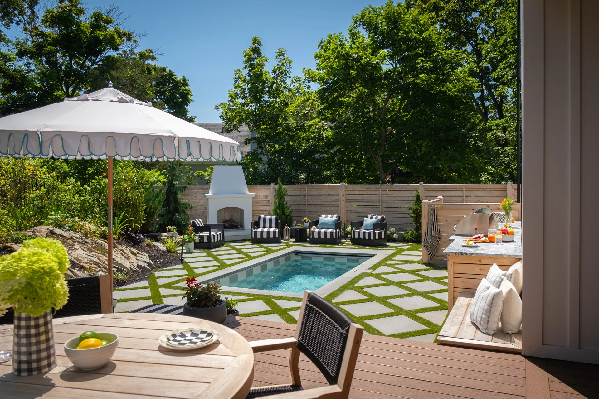 [small-spaces][flush]SMALL SOAKE POOL WITH CHECKERBOARD POOL TILE AND GEOMETRIC PATIO PAVERS.