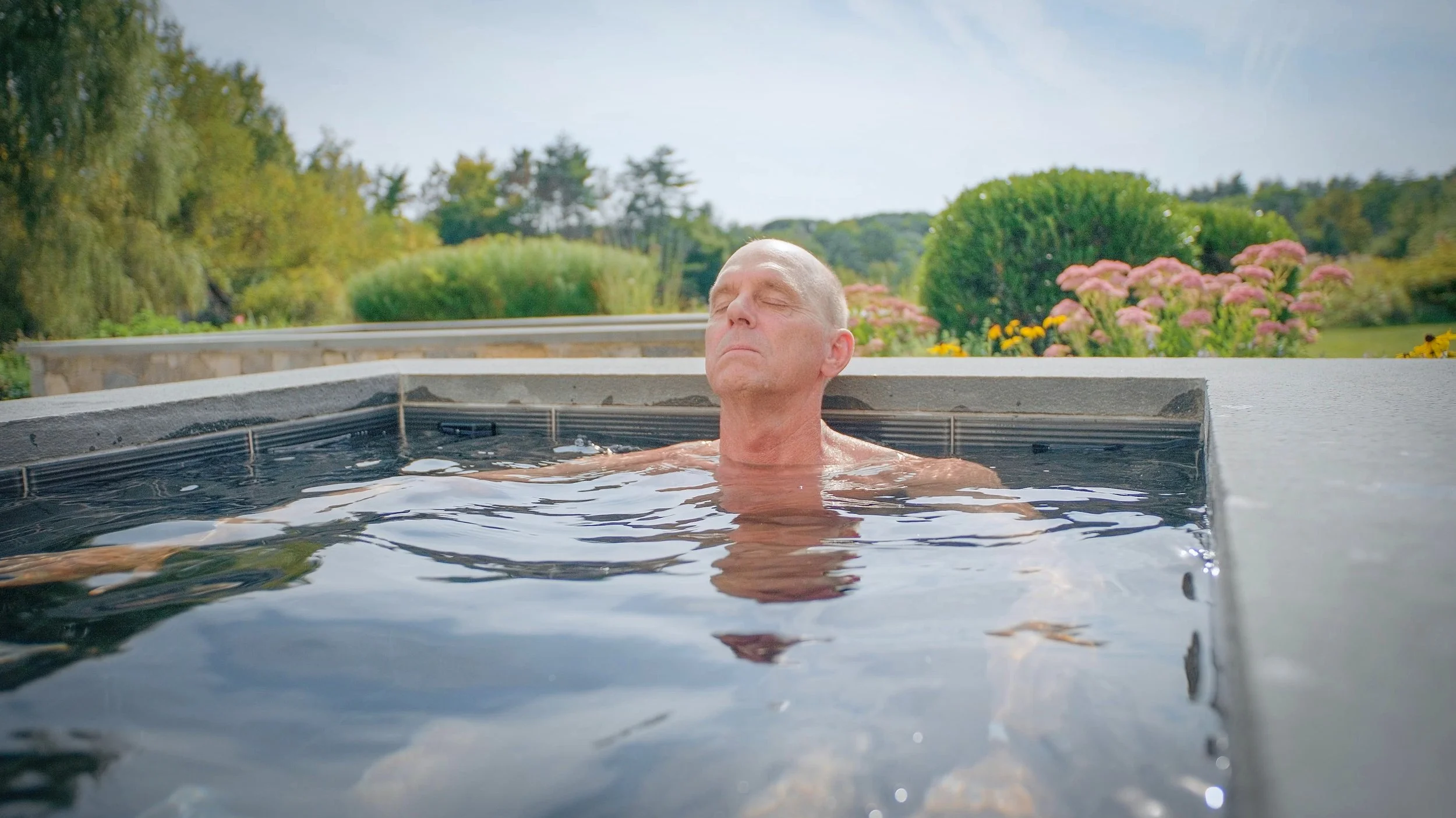 Rowdy Gaines practices cold water immersion in a Soake pool, supporting post-workout recovery, reduced inflammation, and overall wellness.