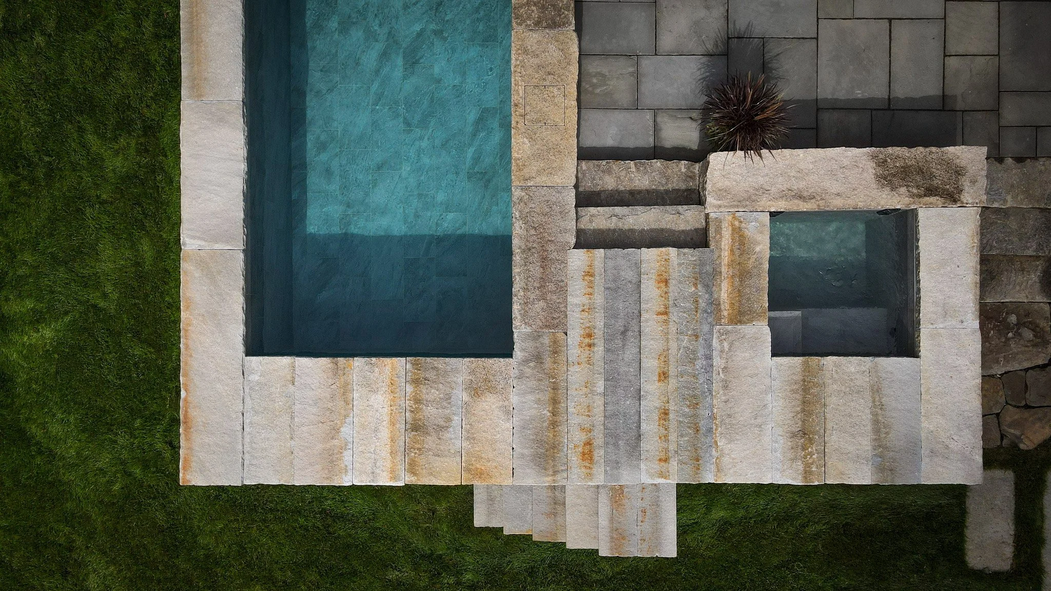 A 7X13 AND COLD PLUNGE PARED PERFECTLY AROUND RECLAIMED STONE FROM LOCAL SITES IN IPSWICH, MA