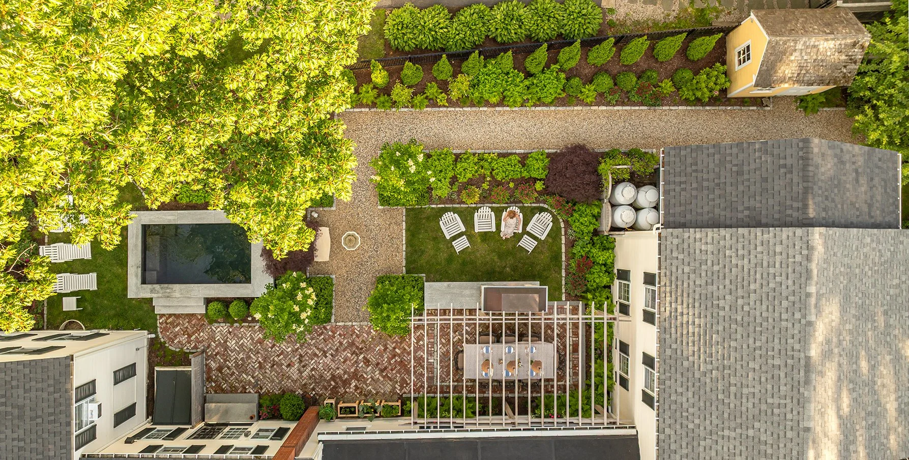 [raised][small-space]BIRD’S EYE VIEW OF A COASTAL MAINE OASIS FEATURING A SOAKE POOL