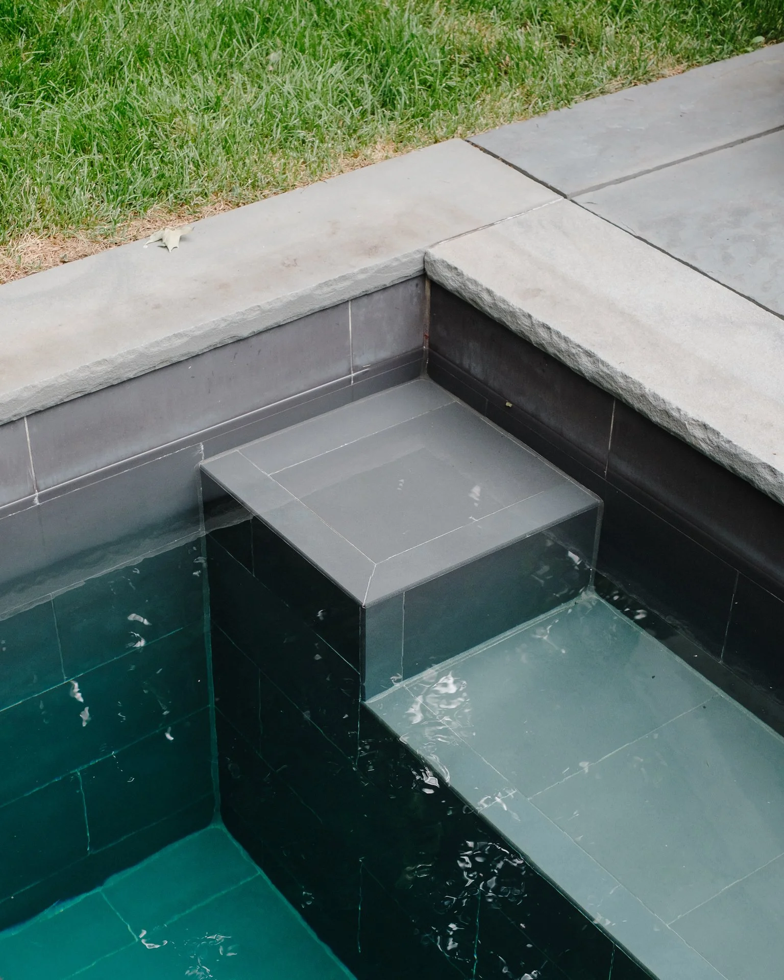 MOODY WATER TONES WITH DARK TILE.