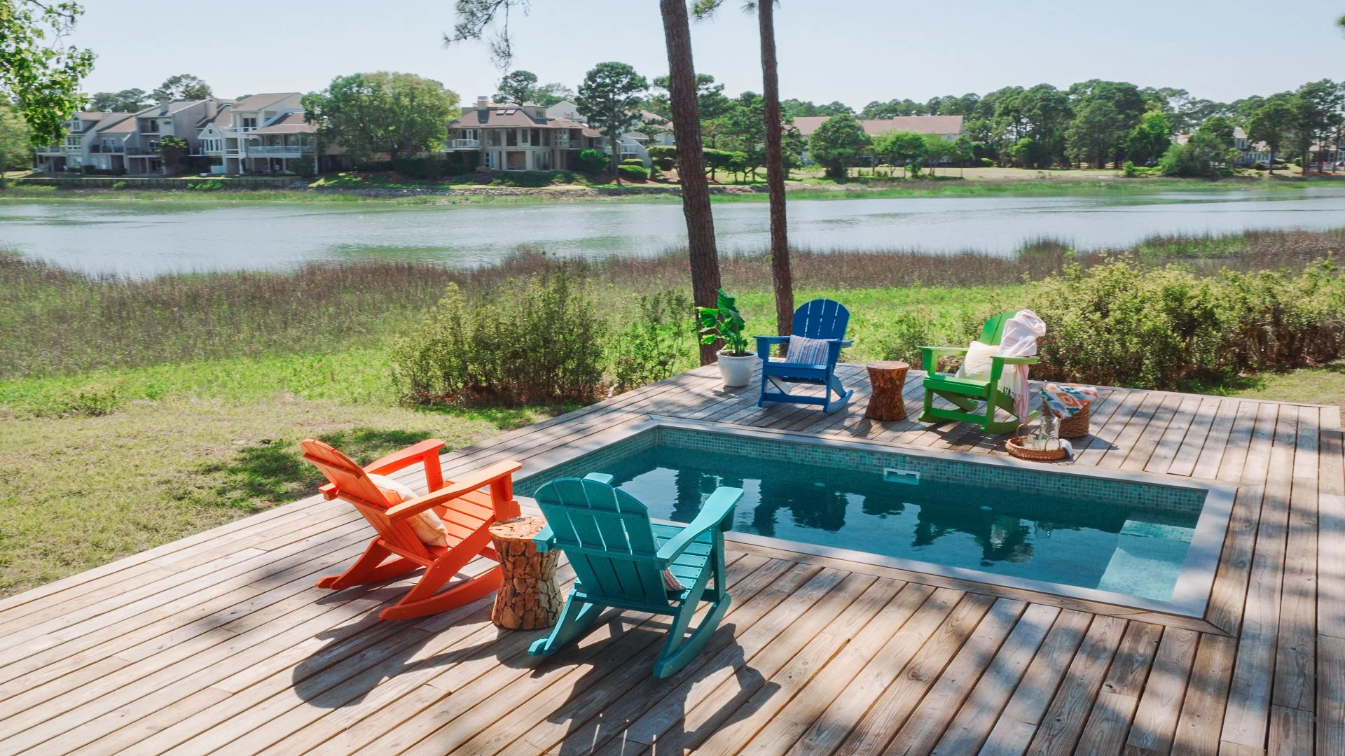 THIS CUSTOM MOSAIC-TILED PLUNGE POOL FITS SEAMLESSLY INTO A COASTAL SOUTH CAROLINA DECK WITH BEAUTIFUL MARSH VIEWS.