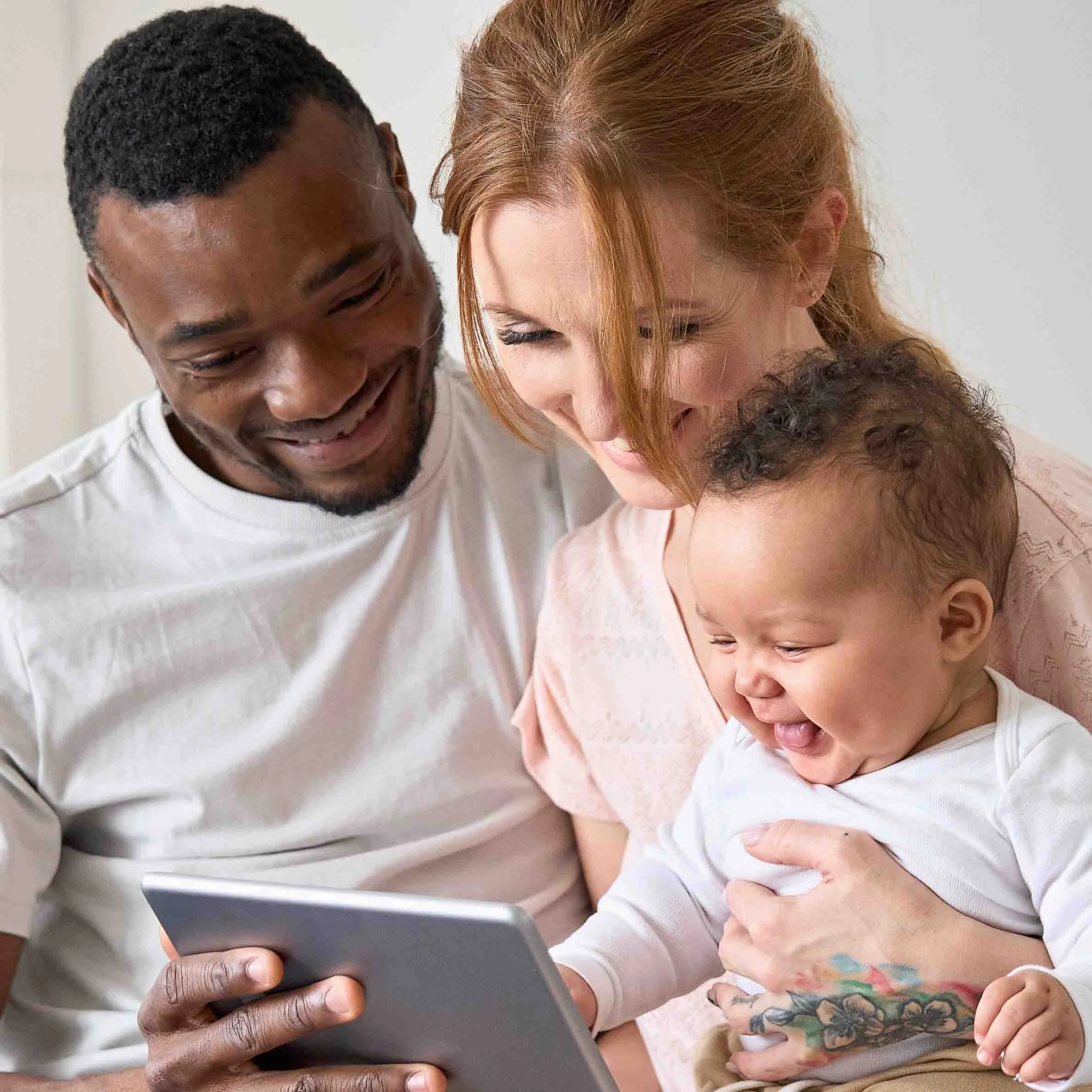 mixed race couple with baby