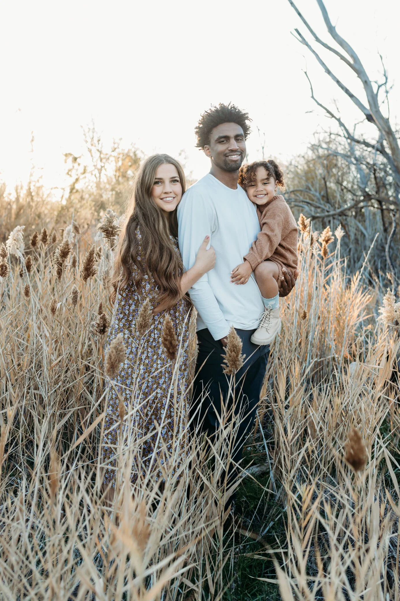 biracial family in wheat fields