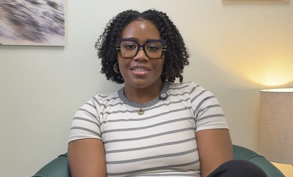This is another picture of Sharie Quinn, LCSW, a therapist at Heart of Texas Therapy Services who specializes in treating Anxiety and OCD. She is wearing glasses and a striped shirt.