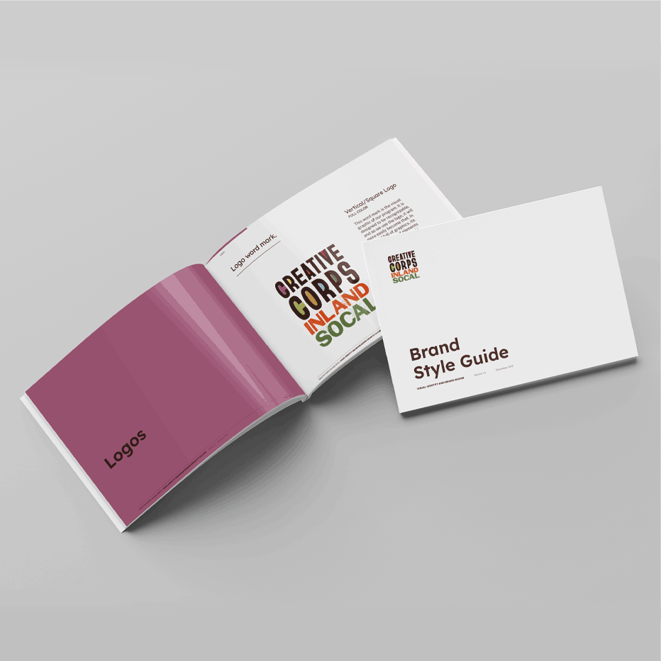 Open brand style guide booklet featuring a page with the title 'Logos' and a logo layout page for 'Creative Corps Inland Socal' in various colors and formats.