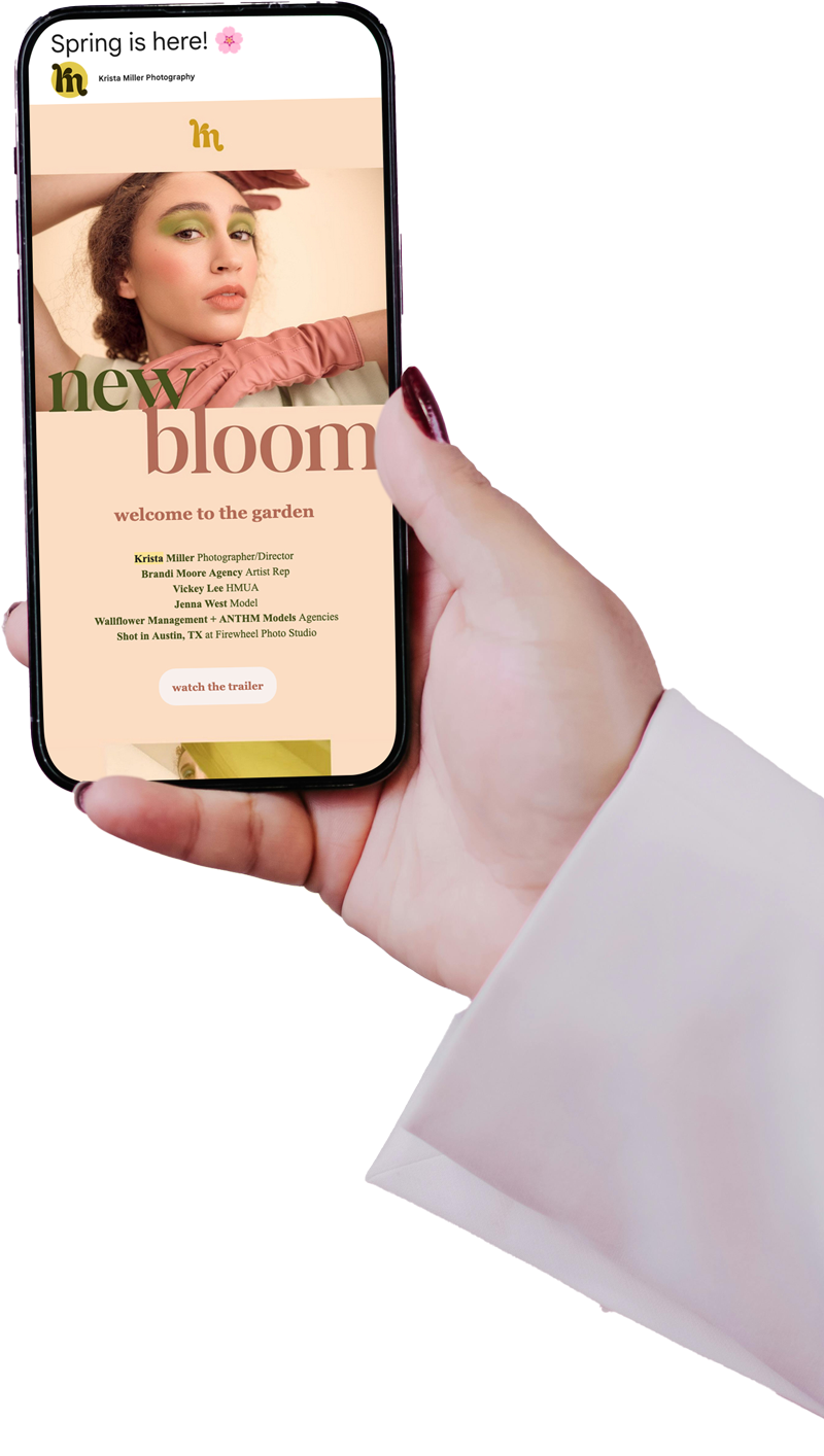 Close-up of a hand holding a smartphone displaying a spring-themed fashion email with a model, colorful text, and beauty photography.