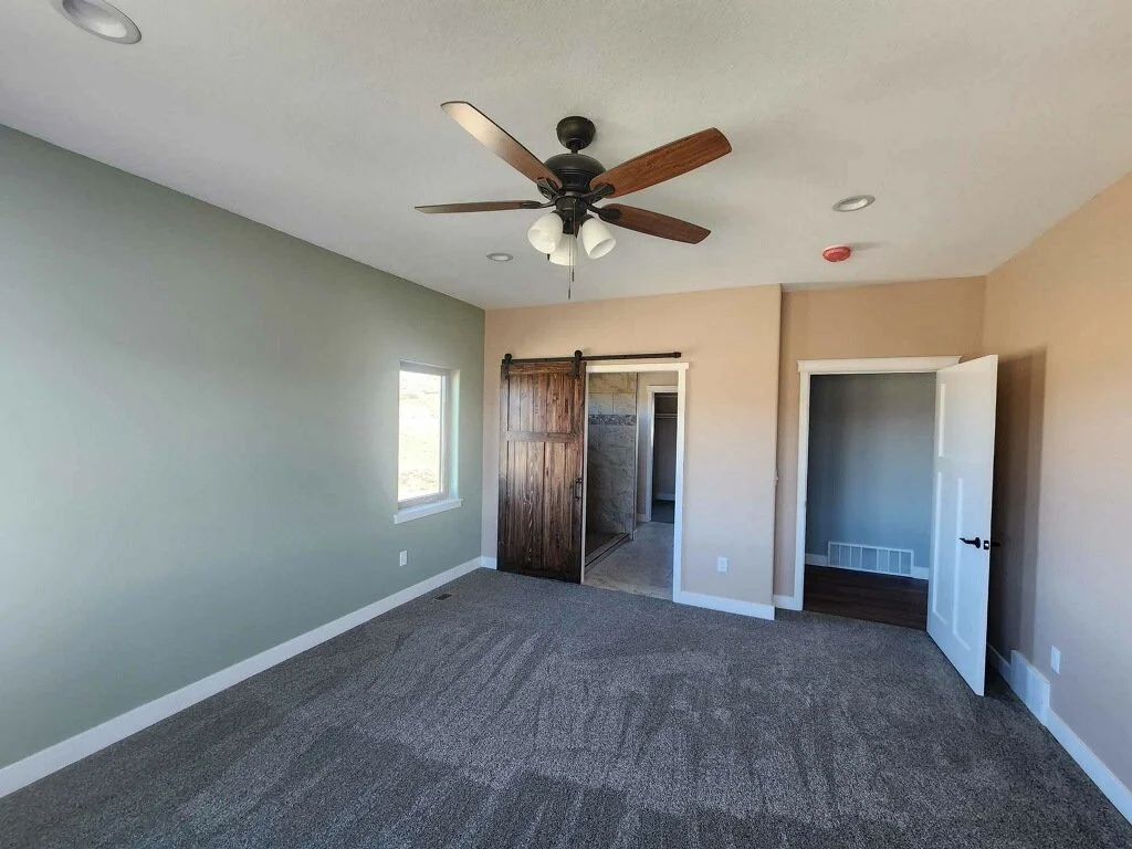 Primary bedroom in custom wyoming home