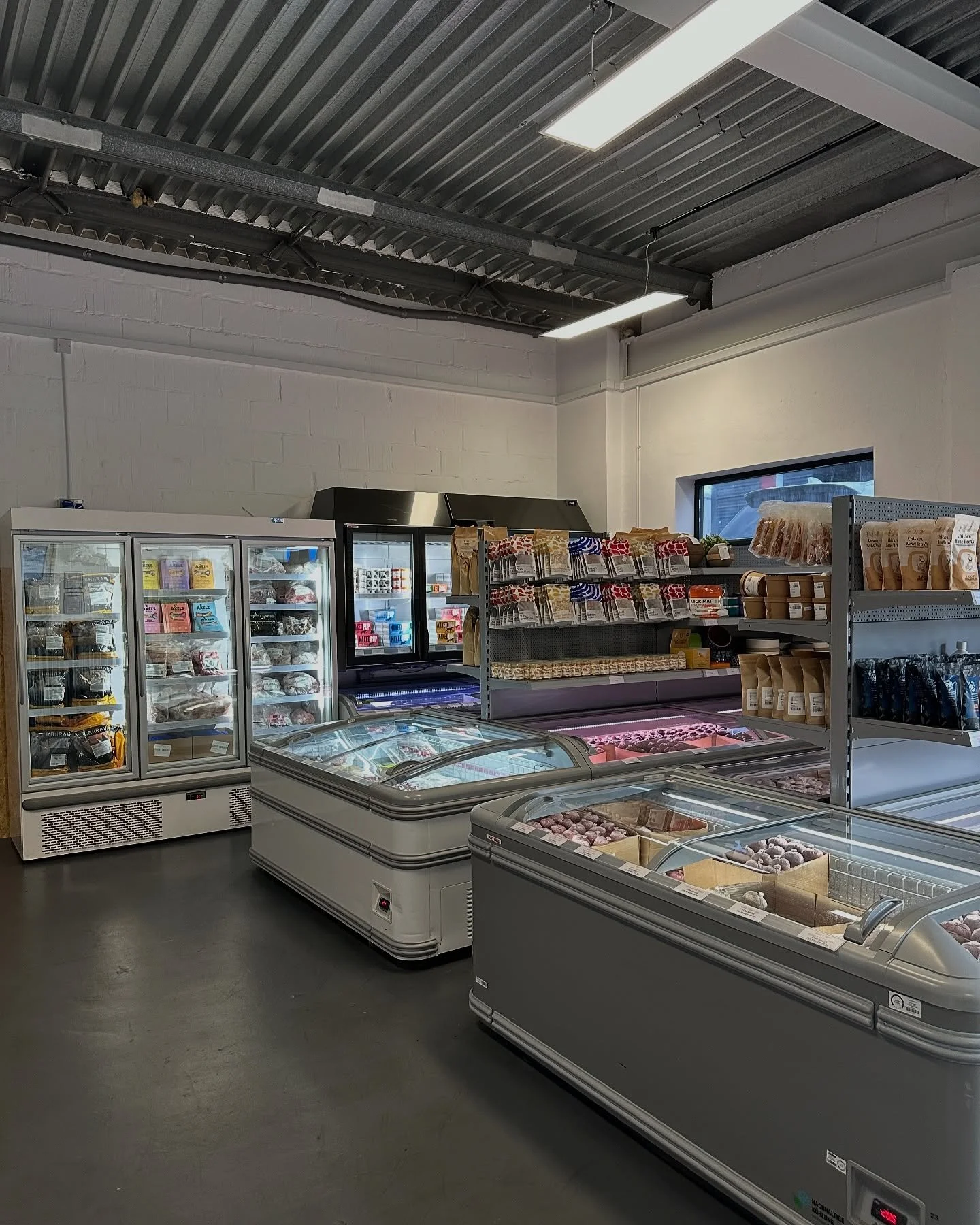  warehouse space with fridges containing dog food and frozen treats for dogs  