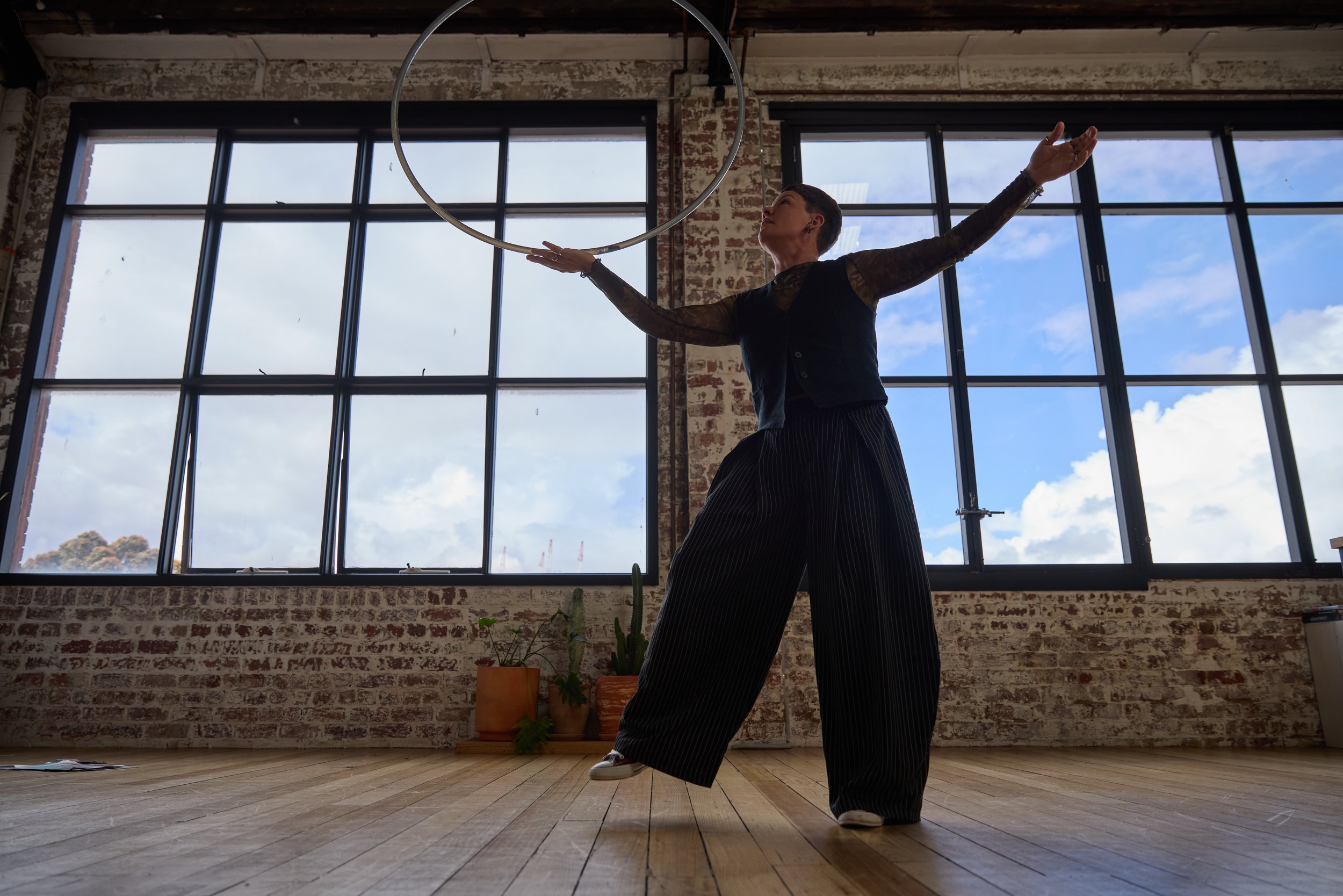 Deanne Love is balancing a hula hoop on her hand in a counselling room in Melbourne, Australia