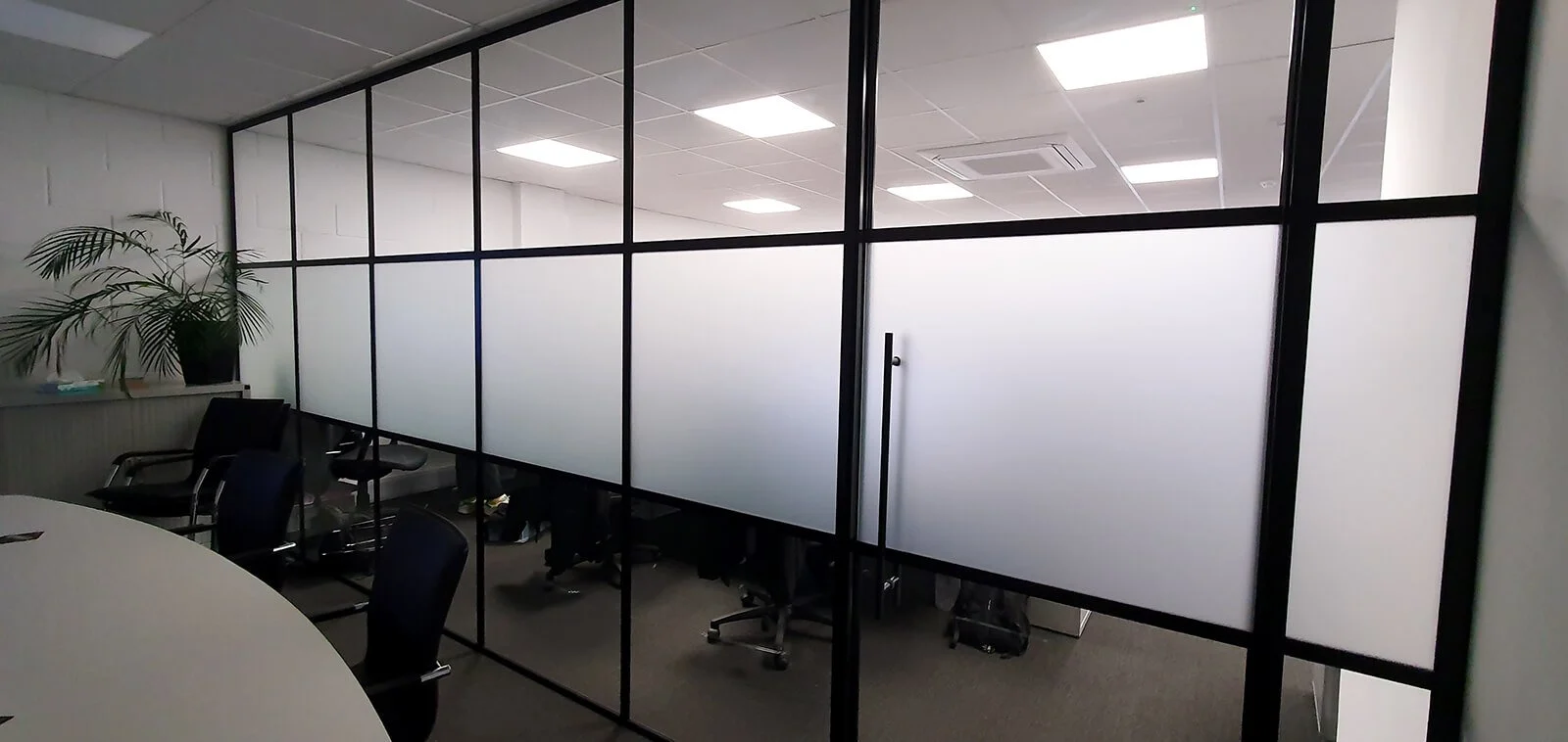 office glass partition with frosted manifestation window film for privacy