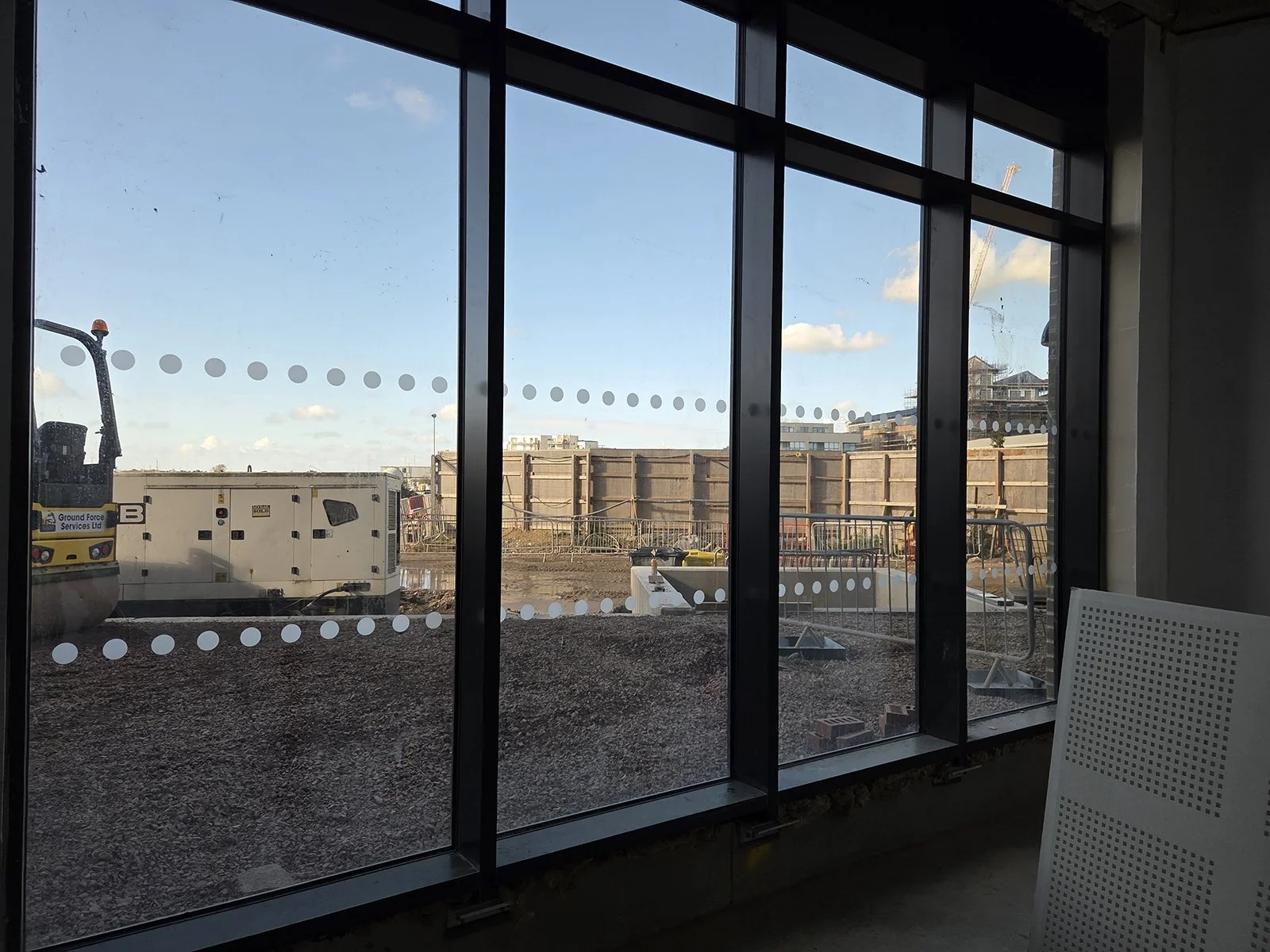 manifestation dots installed on facade glazing on construction site