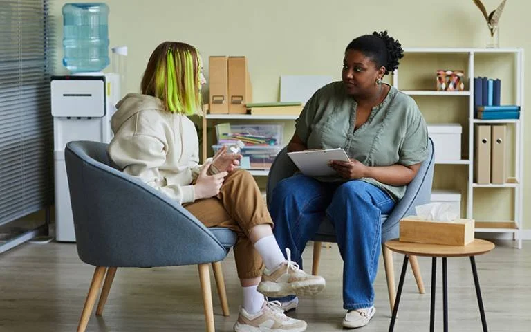 Young person having a supportive mental health conversation