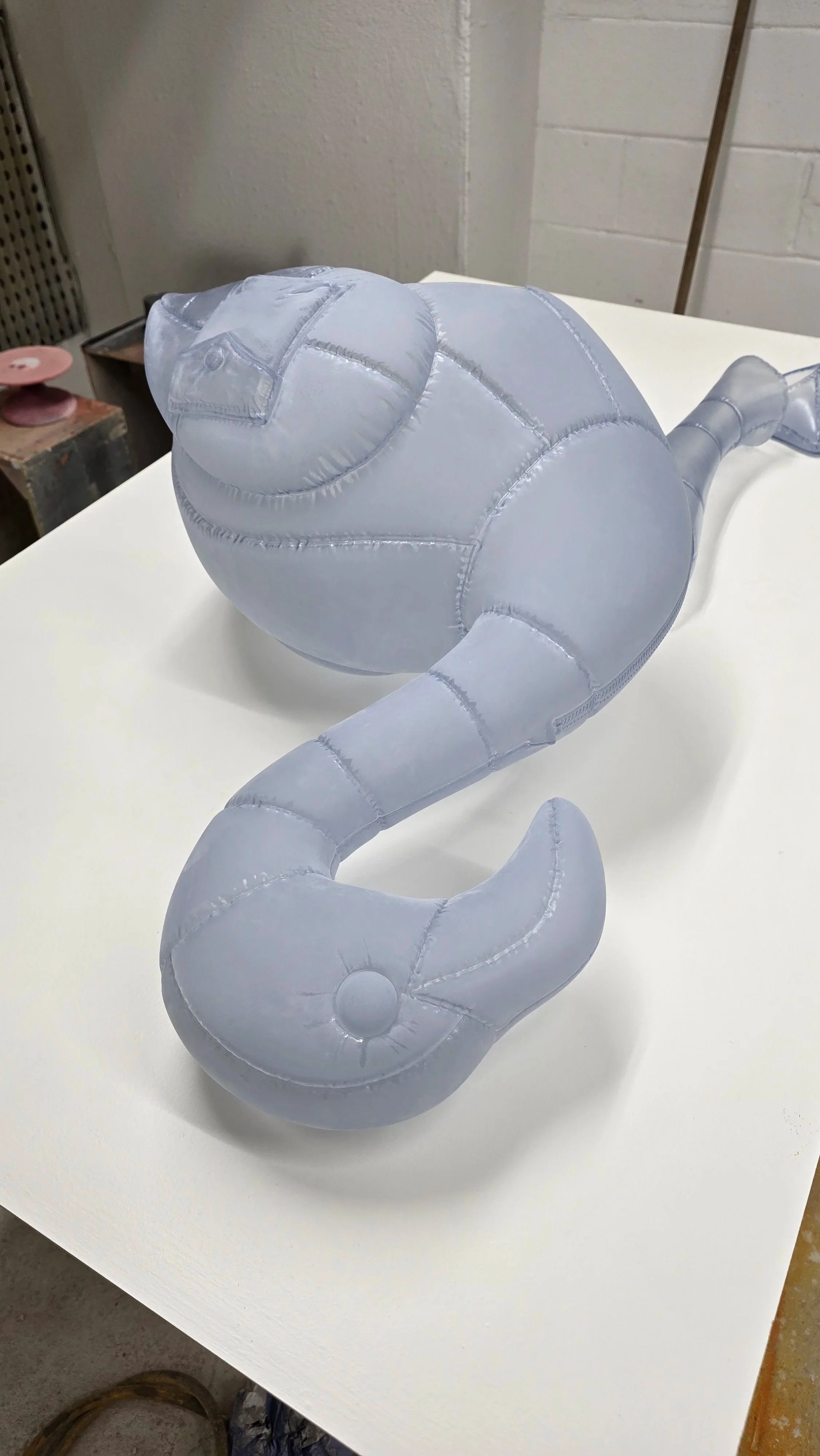 Behind-the-scenes fabrication of the Moncler animal sculptures, showing the translucent components bonded together before final finishing.