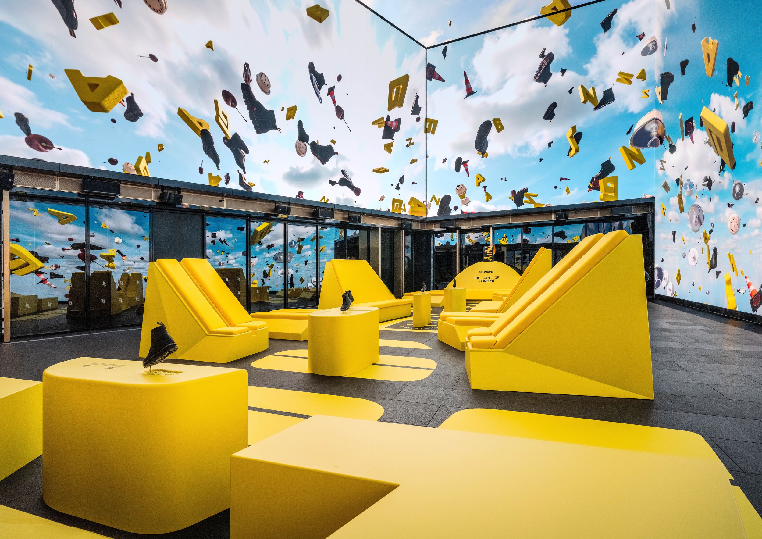 Image of the custom upholstered seats, vinyl floor and product plinths for the Dr Martens ZebZag launch event in Outernet in London