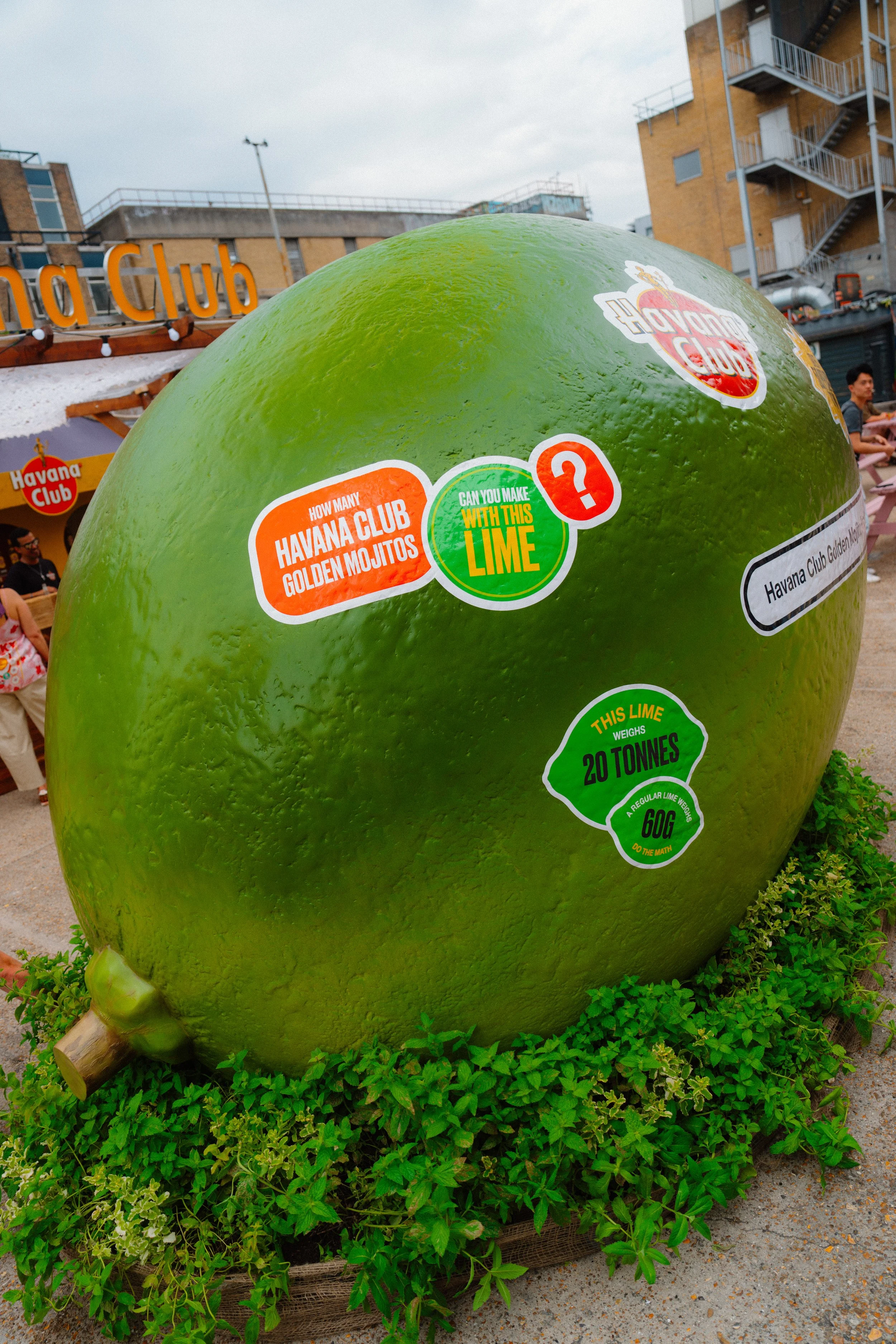 Close-up detail of hand-carved and hard-coated lime sculpture with spray-painted finish, created for an outdoor pop-up installation. Custom printed vinyl graphics applied to textured lime sculpture surface for Havana Club pop-up event.