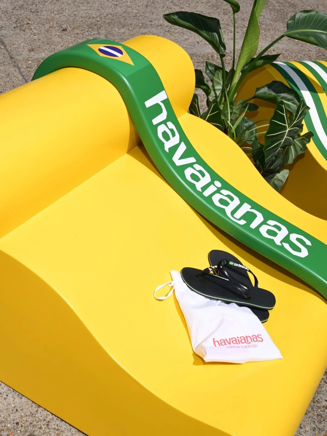 Close up image of the custom flip flop inspired seating with the brands product laid on top