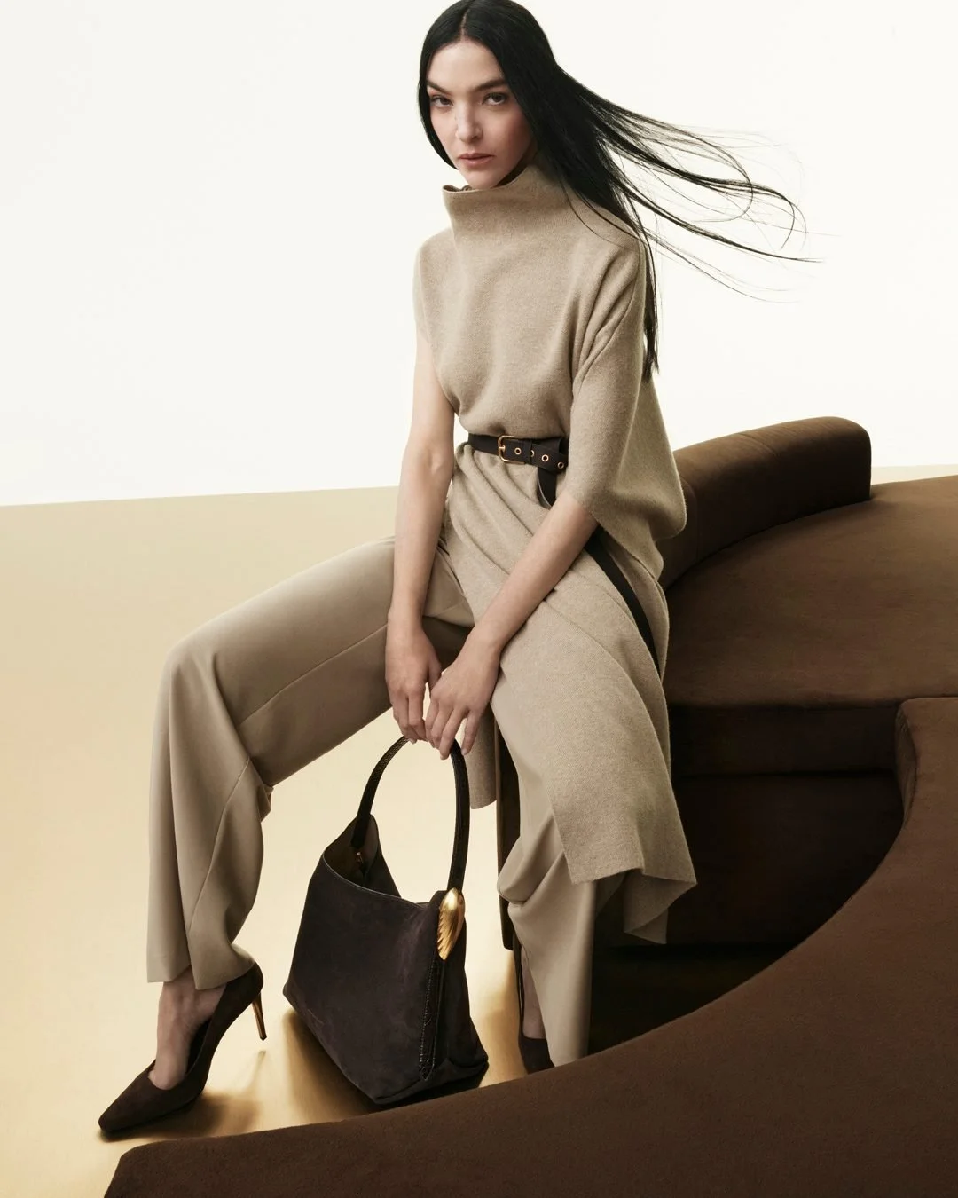Image of Mariacarla Boscono sitting on the custom made sofa we created for this Donna Karen Fall 25 Campaign shoot.