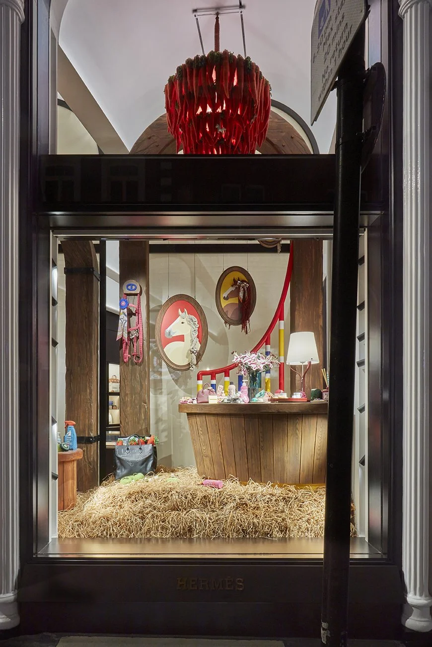 Hand-painted scenic set for Kate Jenkins’ Hermès window installation, using layered paint finishes to create the appearance of aged luxury timber and stable interiors.