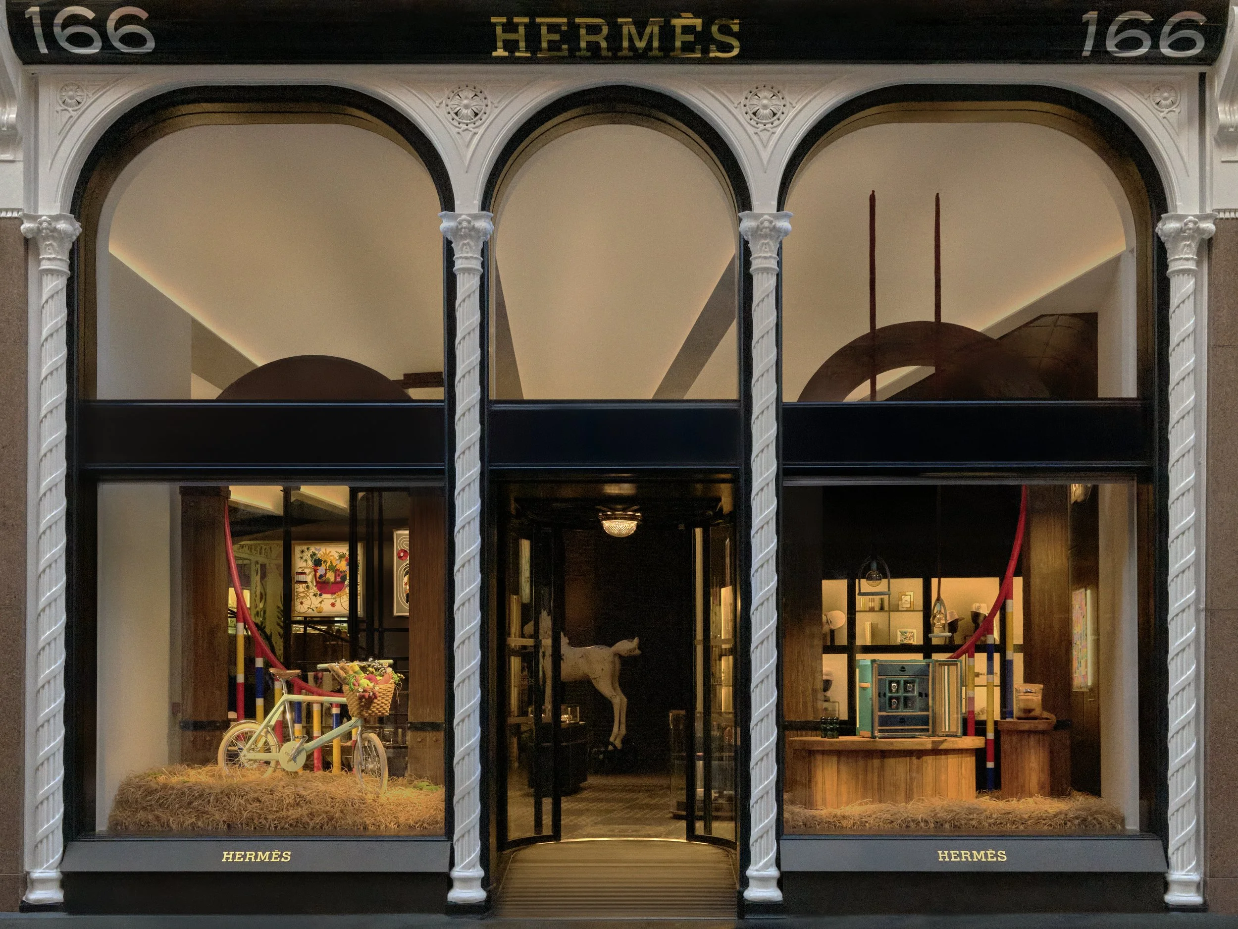 Luxury window display for Hermès at 166 New Bond Street, featuring Kate Jenkins’ ‘The Rocabarn’ installation with bespoke scenic fabrication by Andy Knight.