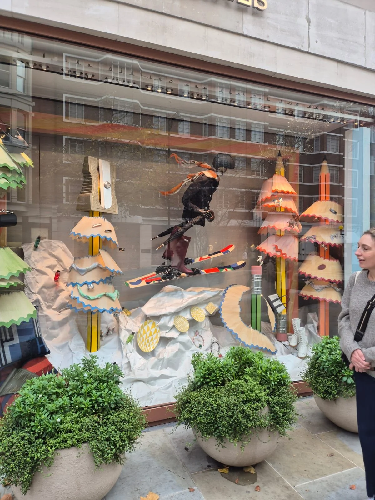 Bespoke Christmas window installation for Hermès, designed by Shona Heath and built by Andy Knight, including oversized wooden pencil trees and wood veneer pencil shavings with washed paint effect.  The window landscape is sculpted white satin snow. 
