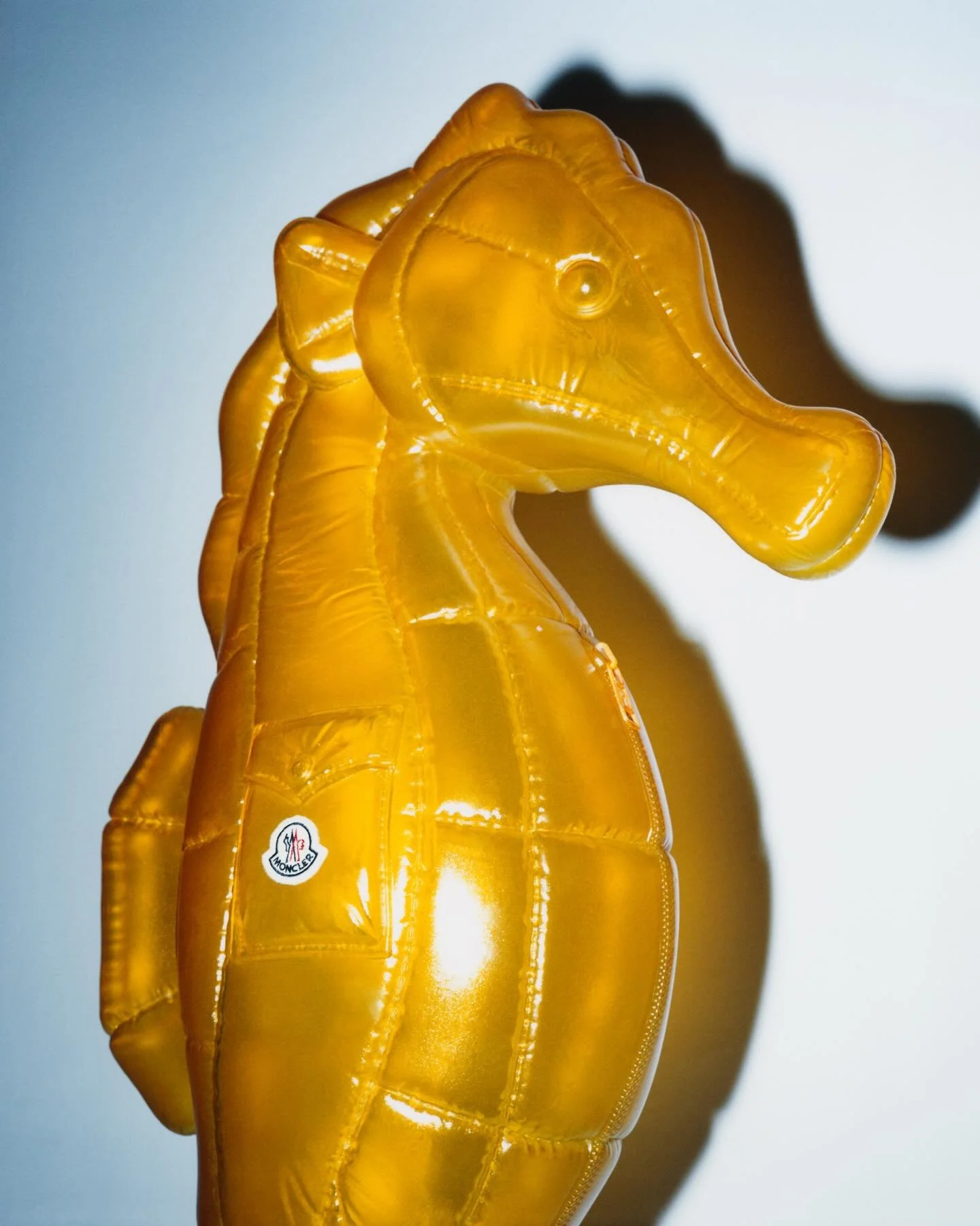 Moncler ‘Have a Puffy Summer’ 2026 campaign featuring the large-scale semi-transparent seahorse sculpture designed by Andy Hillman and fabricated by Andy Knight.