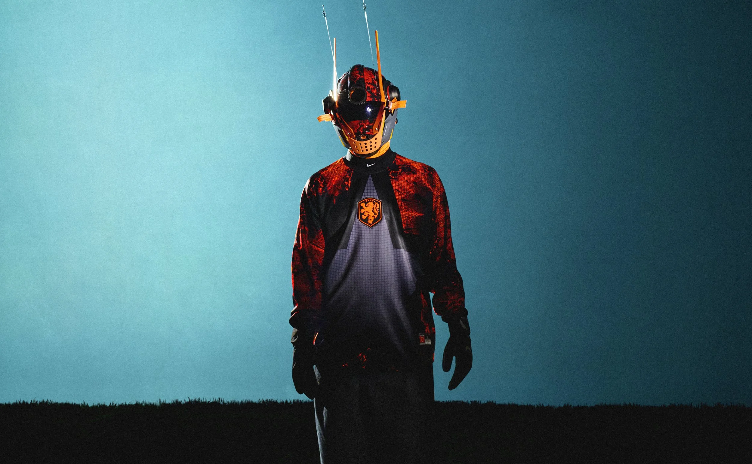 Image of a model wearing the Netherlands football shirt and custom made mask for the nike football hollywood keepers collection. 