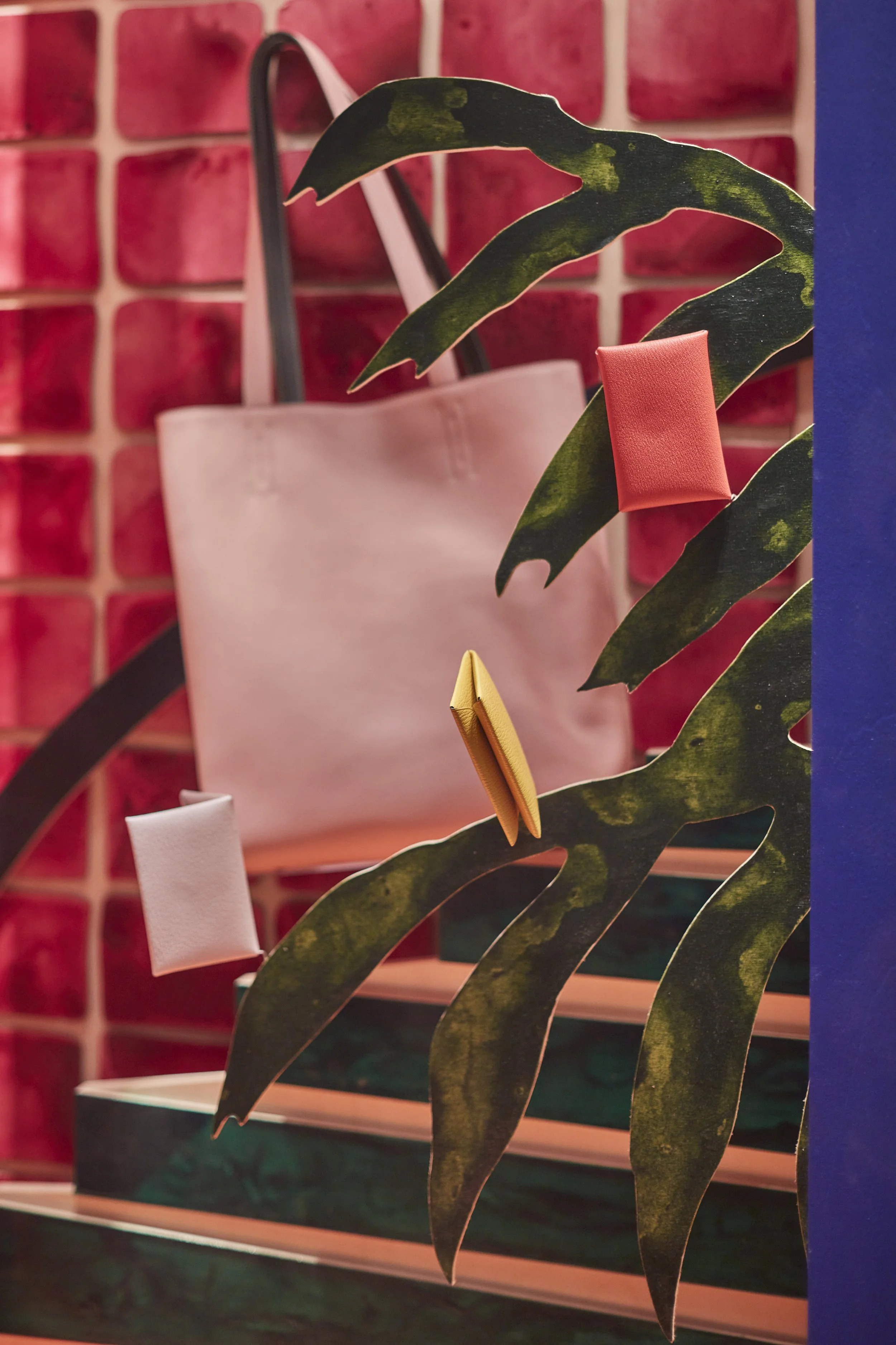Close-up images of the hand-painted architectural forms, foliage elements and display features we fabricated for the Hermès “Internal Landscapes” windows, including product styling within the set. These details showcase our capabilities in fine-finis