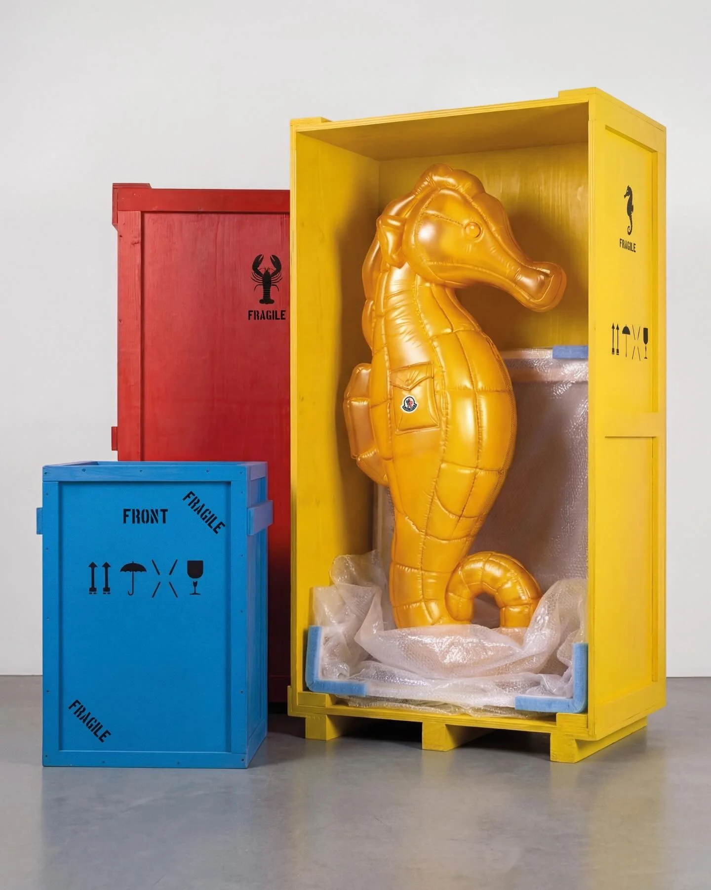 Moncler ‘Have a Puffy Summer’ 2026 campaign featuring the large-scale semi-transparent seahorse sculpture designed by Andy Hillman and fabricated by Andy Knight.