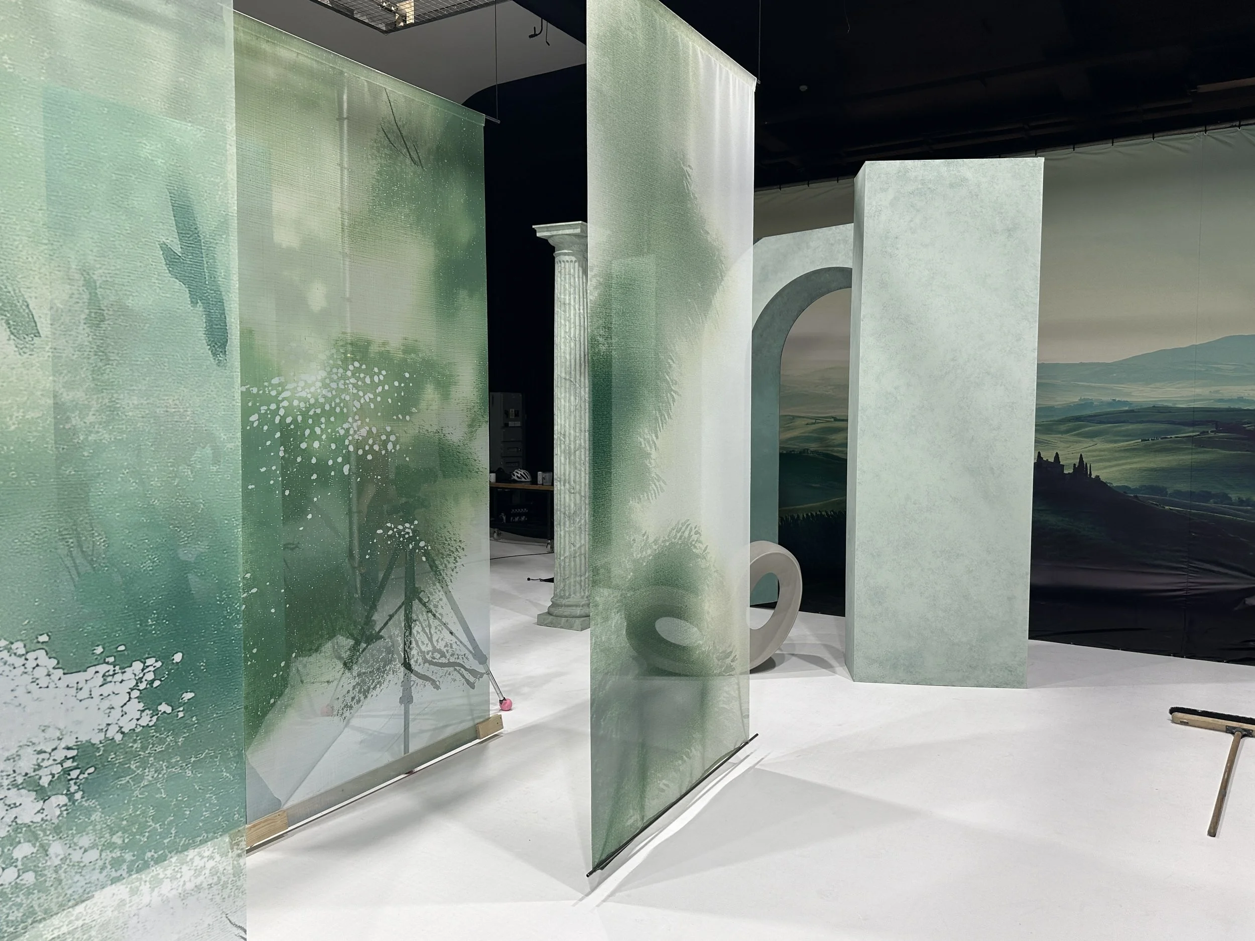 Side elevation of the installation highlighting the spatial arrangement of the translucent scenic elements and their contribution to the set's shifting perspectives.