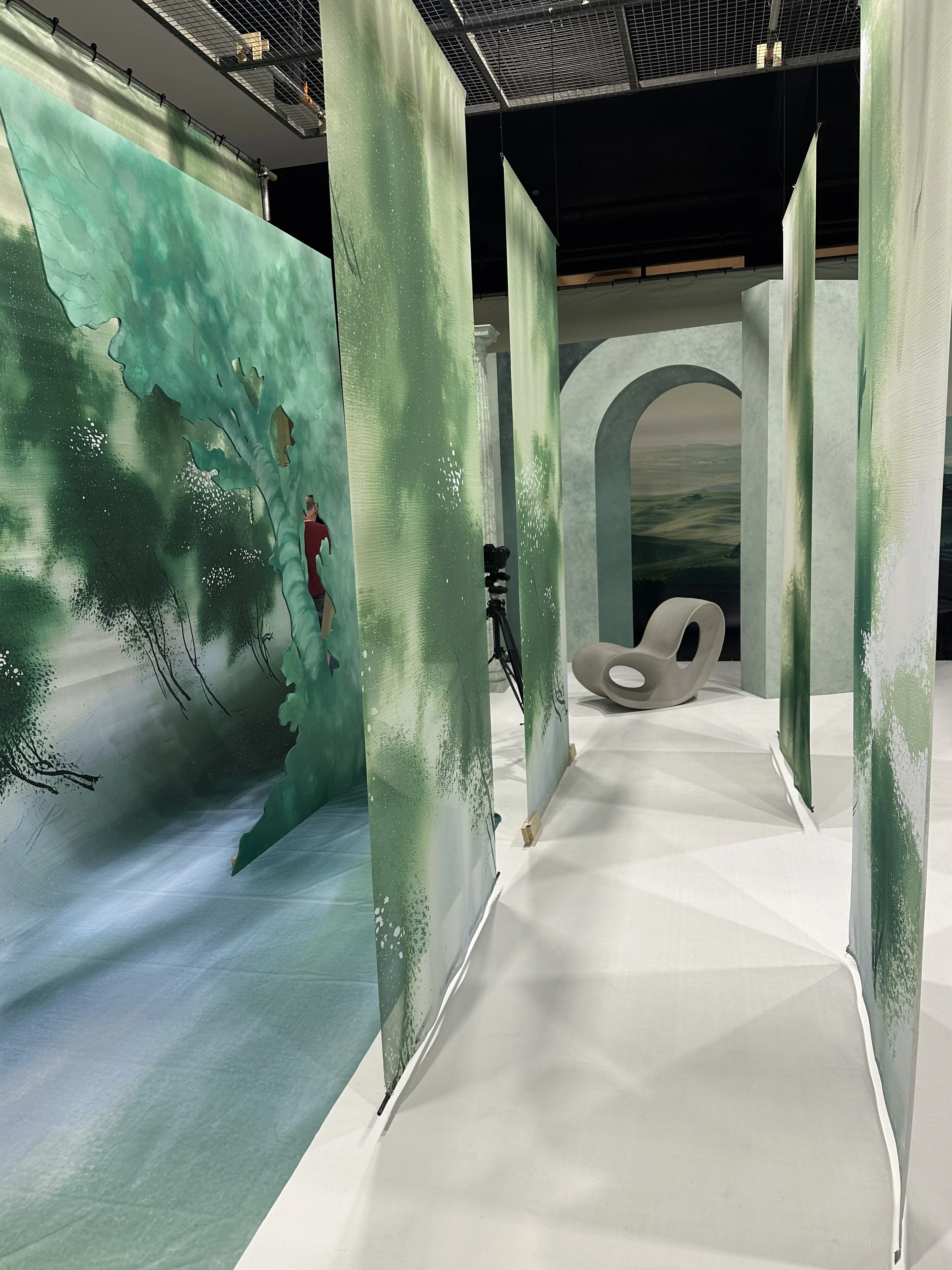 View through the finished installation, demonstrating how the layered scenic elements create depth, framing and visual movement for photography and film.