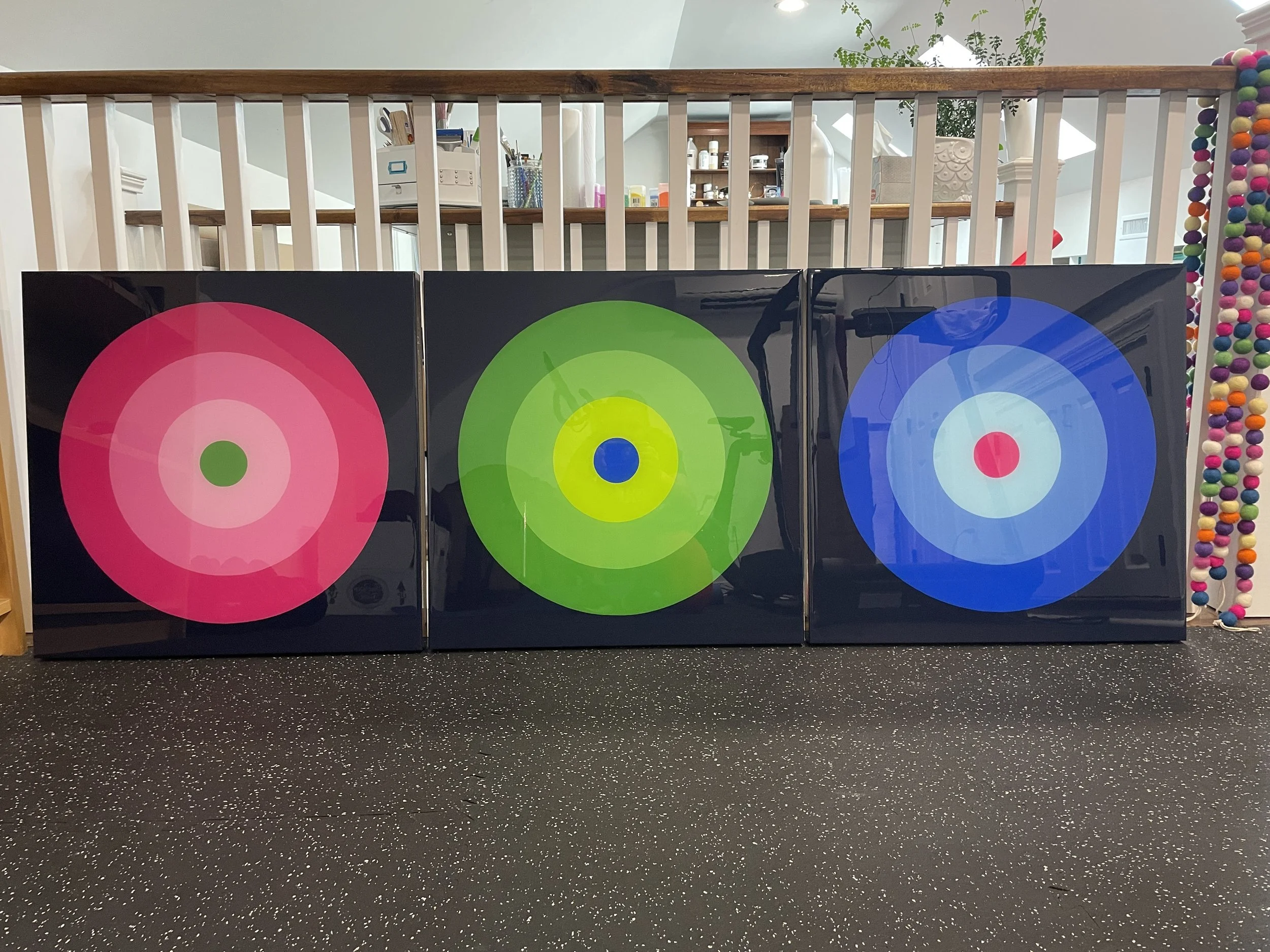 Merrill Moore's Taking Aim series is an ongoing geometric series exploring focus, intention, direction, and personal momentum through bold bullseye compositions and vibrant color relationships. Balancing simplicity with precision, each piece examines