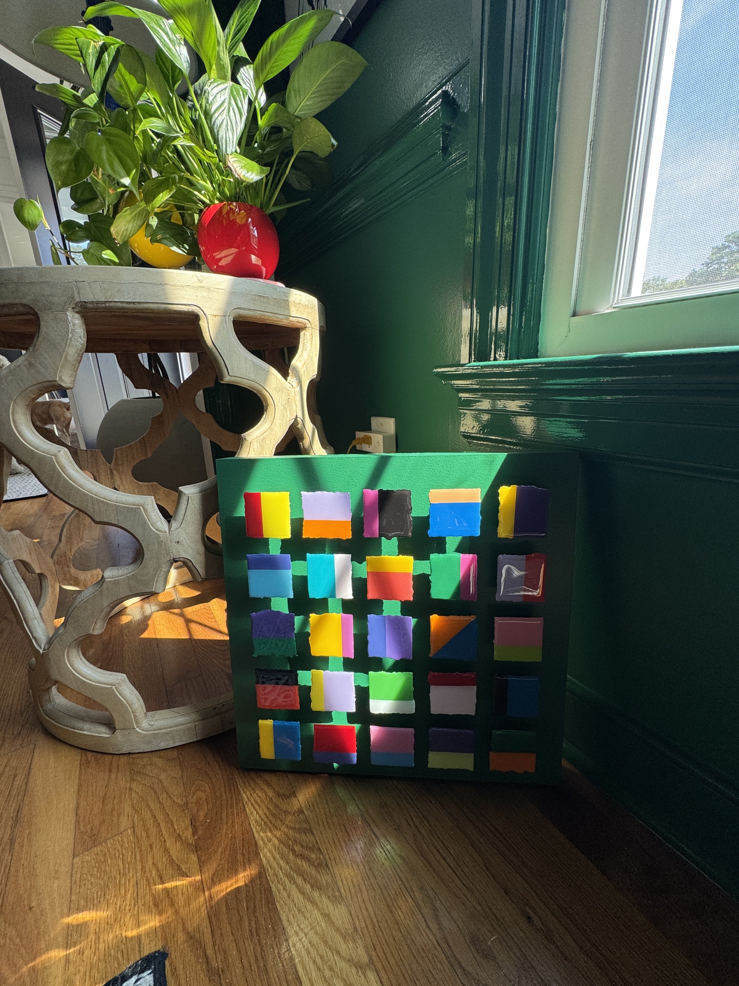 Modern geometric artwork composed of layered dimensional squares with vibrant color pairings, resin finishes, and sculptural depth. Inspired by movement, balance, and visual interaction, the piece shifts with changing light and perspective.