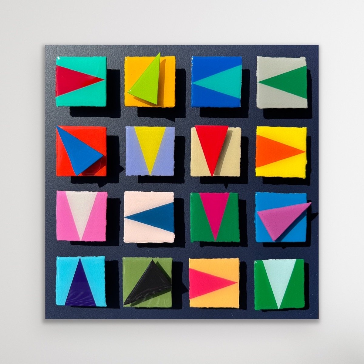 Contemporary geometric abstract artwork featuring dimensional triangular forms, bold color blocking, and layered sculptural depth. Inspired by nautical signal flags and modern design, the composition explores movement, direction, balance, and visual 