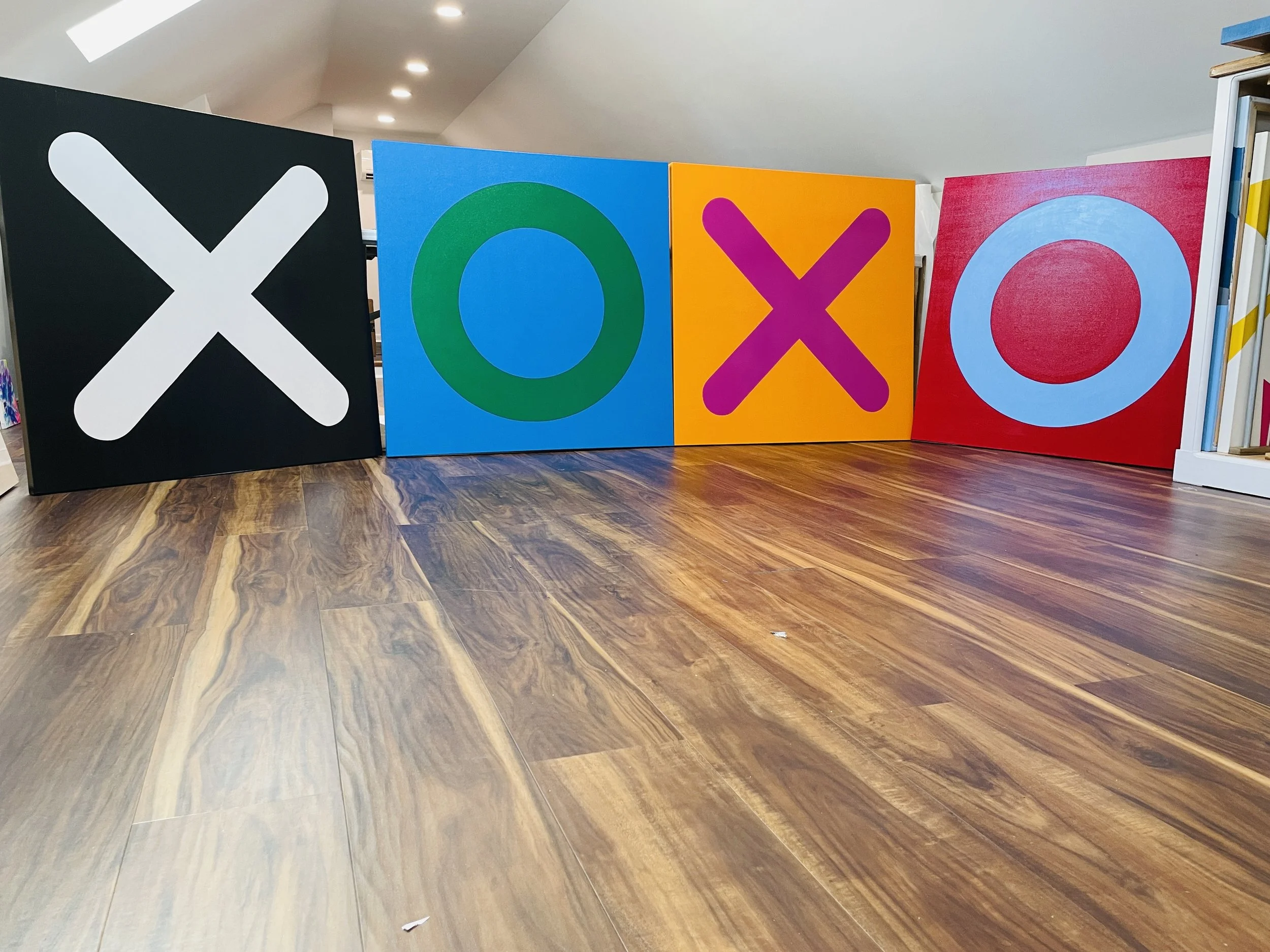 The XOXO Series explores connection, presence, and a daily reminder that love matters. Through bold geometric forms, vibrant color, and large-scale simplicity, each piece brings energy and warmth into the home while creating a striking visual stateme