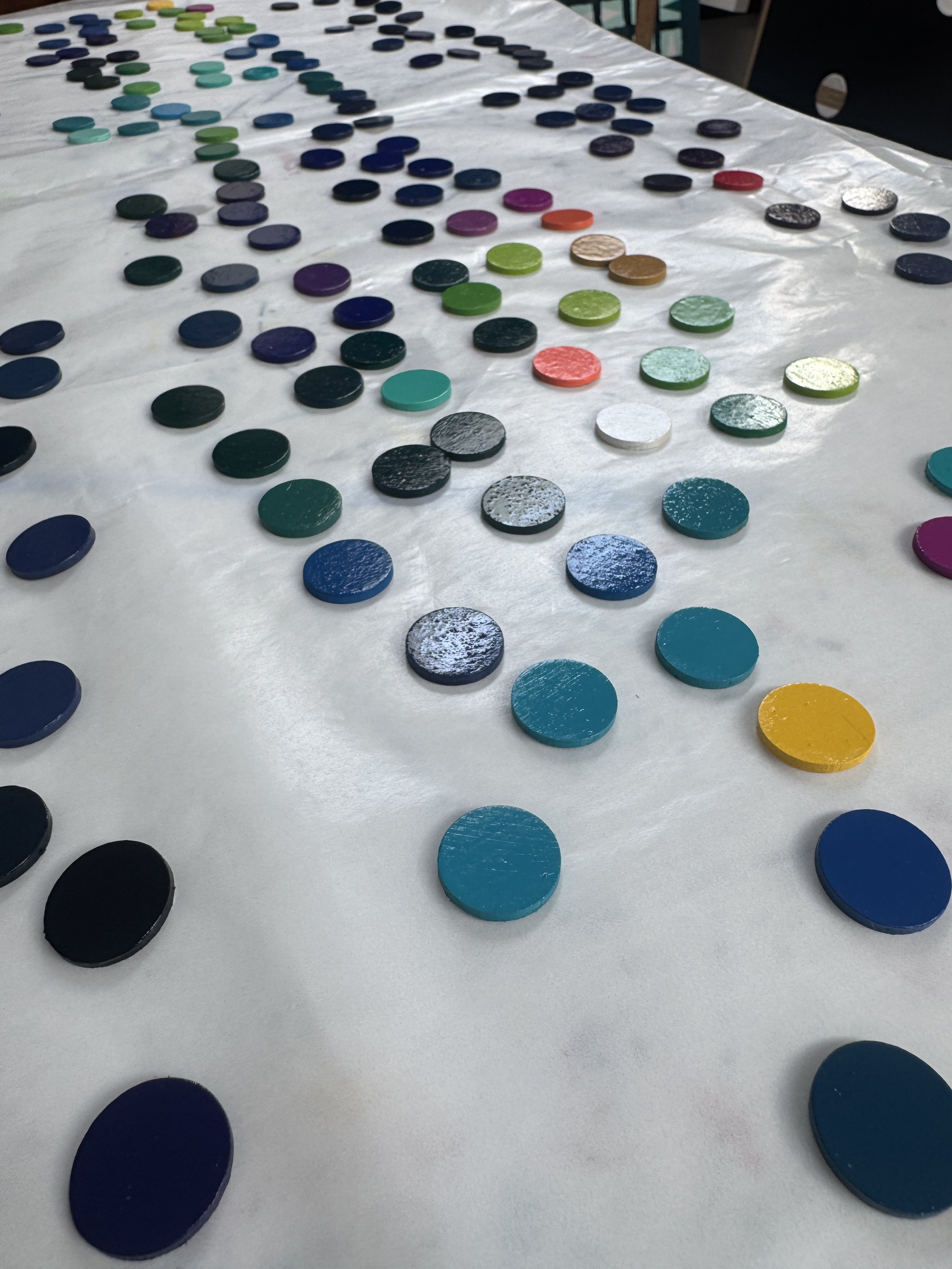 Each wooden disc is hand painted with several layers of paint and several layers of varnish. 