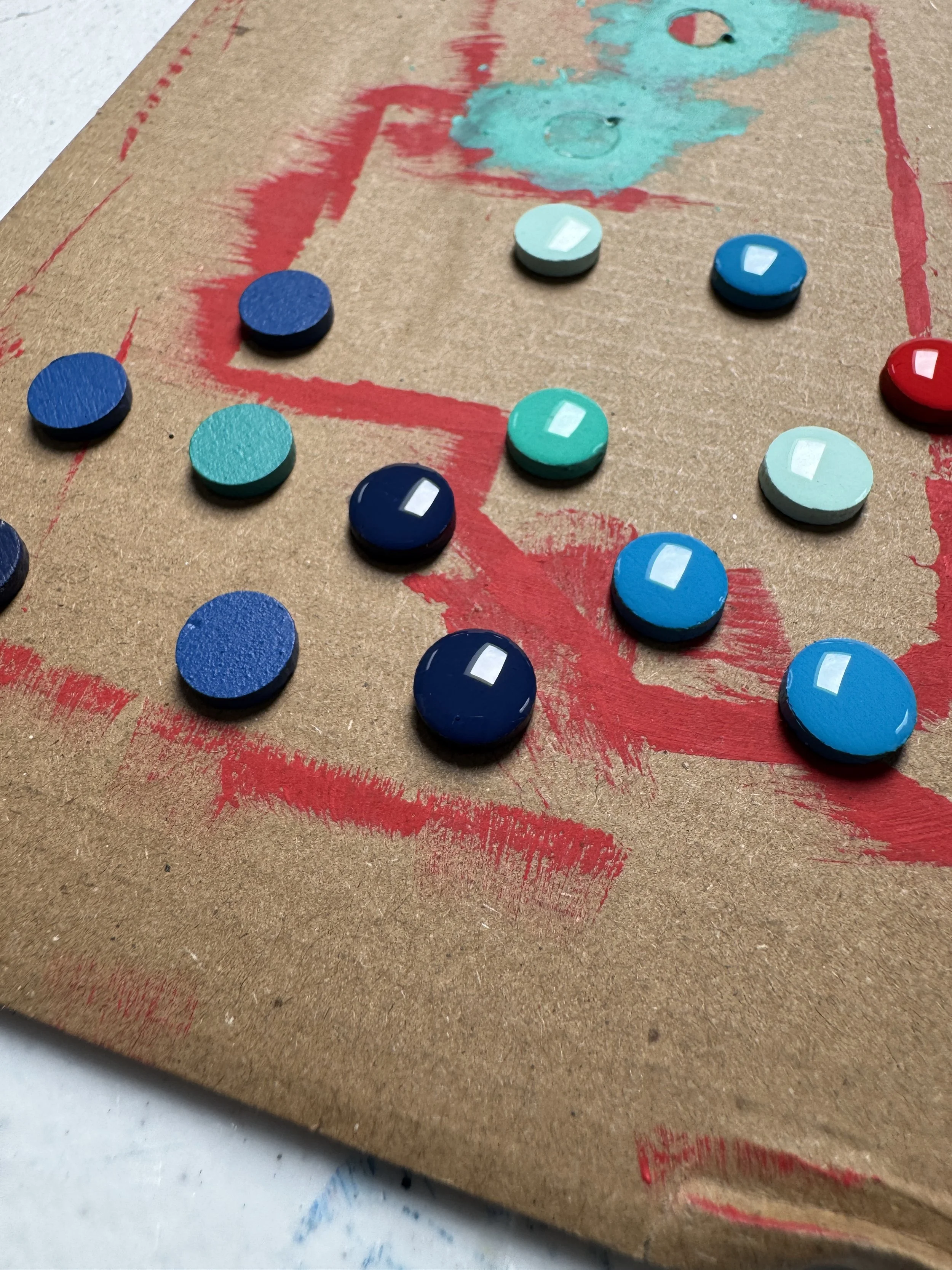 Partially complete resin dots that are used for my signature. 