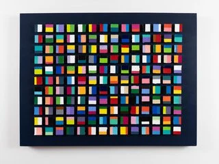Contemporary geometric abstract wall art composed of hundreds of dimensional color-blocked square elements arranged in a structured grid. Featuring bold saturated hues, sculptural depth, and glossy resin finishes, the piece explores rhythm, repetitio