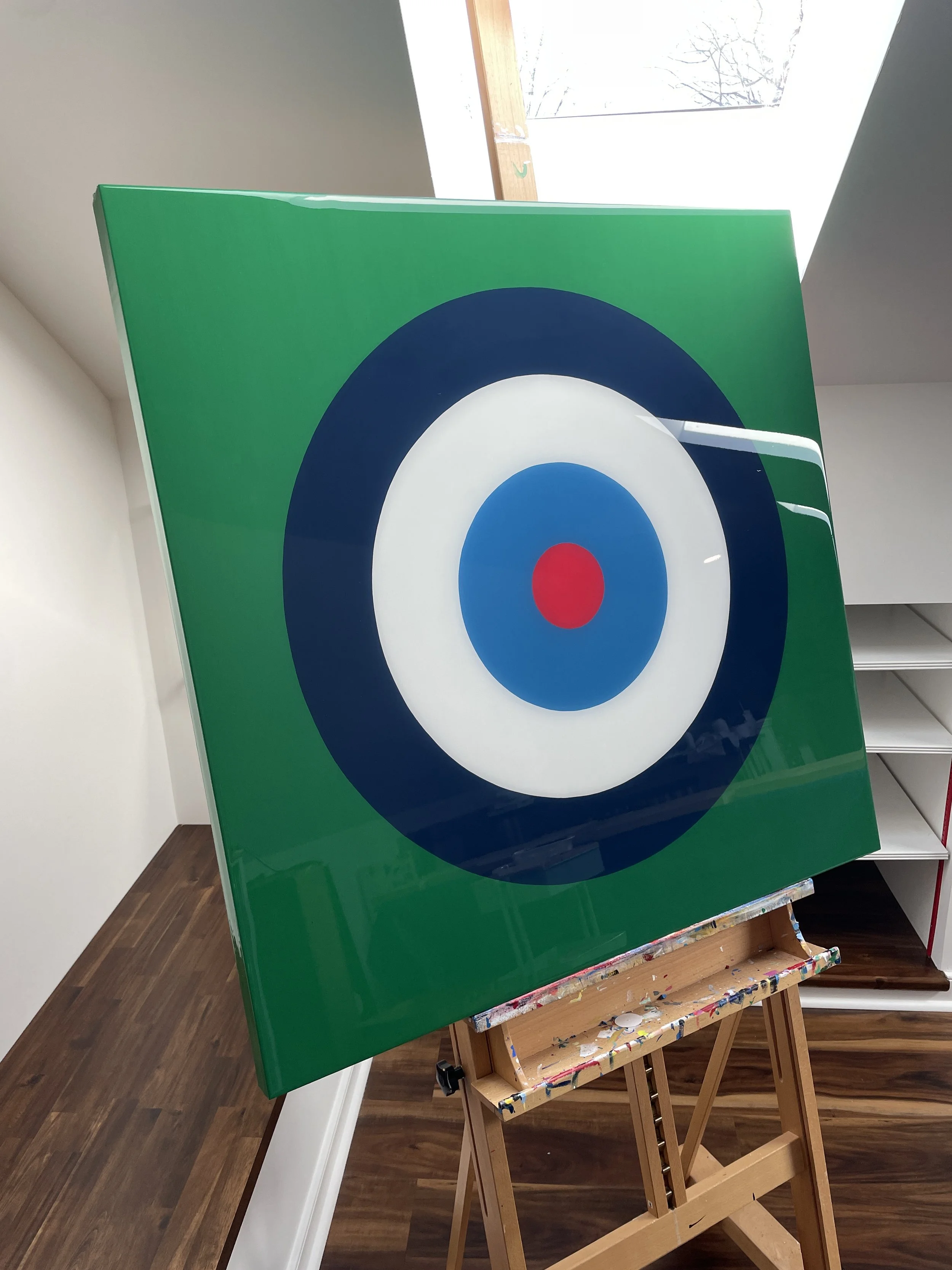 Merrill Moore's Taking Aim series is an ongoing geometric series exploring focus, intention, direction, and personal momentum through bold bullseye compositions and vibrant color relationships. Balancing simplicity with precision, each piece examines