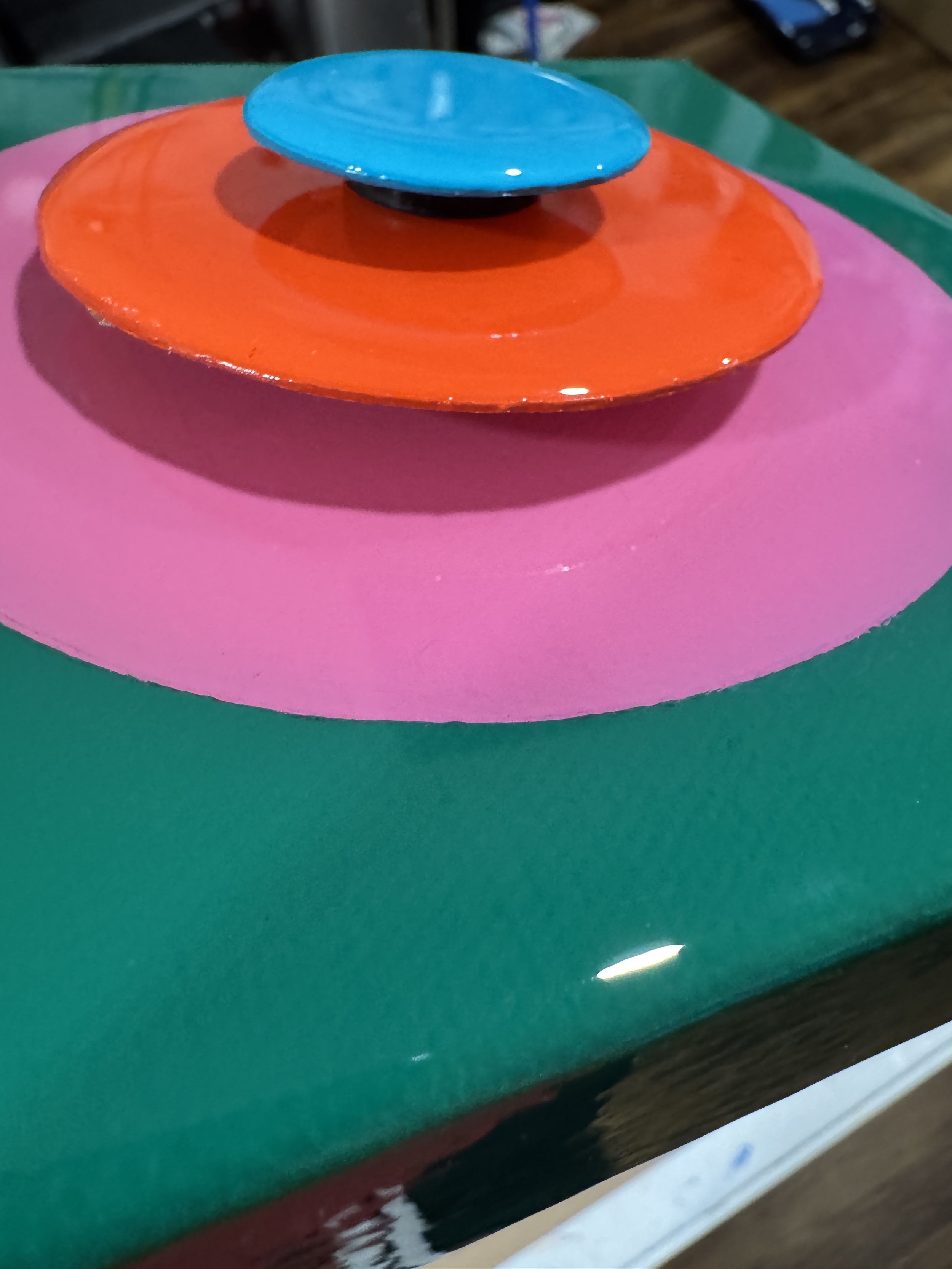 These small-scale Taking Aim pieces combine bold geometric compositions with layered dimensional elements and high-gloss resin surfaces. Exploring focus, direction, and personal momentum, each work uses vibrant color relationships and reflective fini
