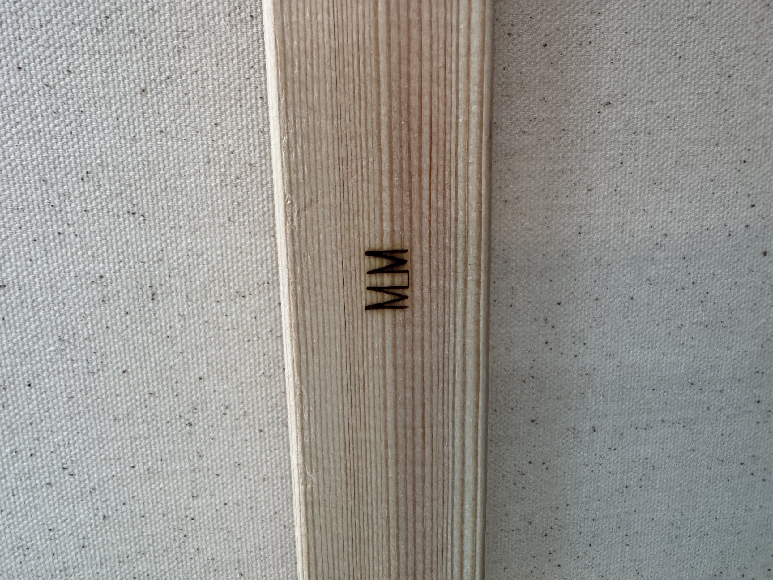 Merrill Moore does not need to be signed on the front of my work, in fact, I think it can often detract. Some are signed on the side, or in braille, but they are all branded on the back of the wooden stretcher with my initials. 
