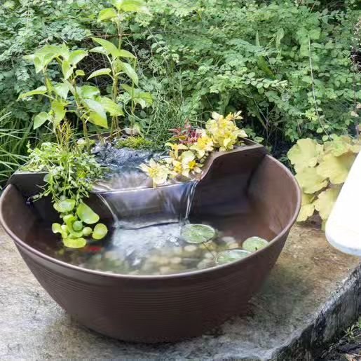 We just released our mini pond packages this week!

Our mini starter ecosystem pond packages typically come in either a mocha brown or charcoal gray container system with a simulated wetland filtration elevated above the bowl to allow a serene water 