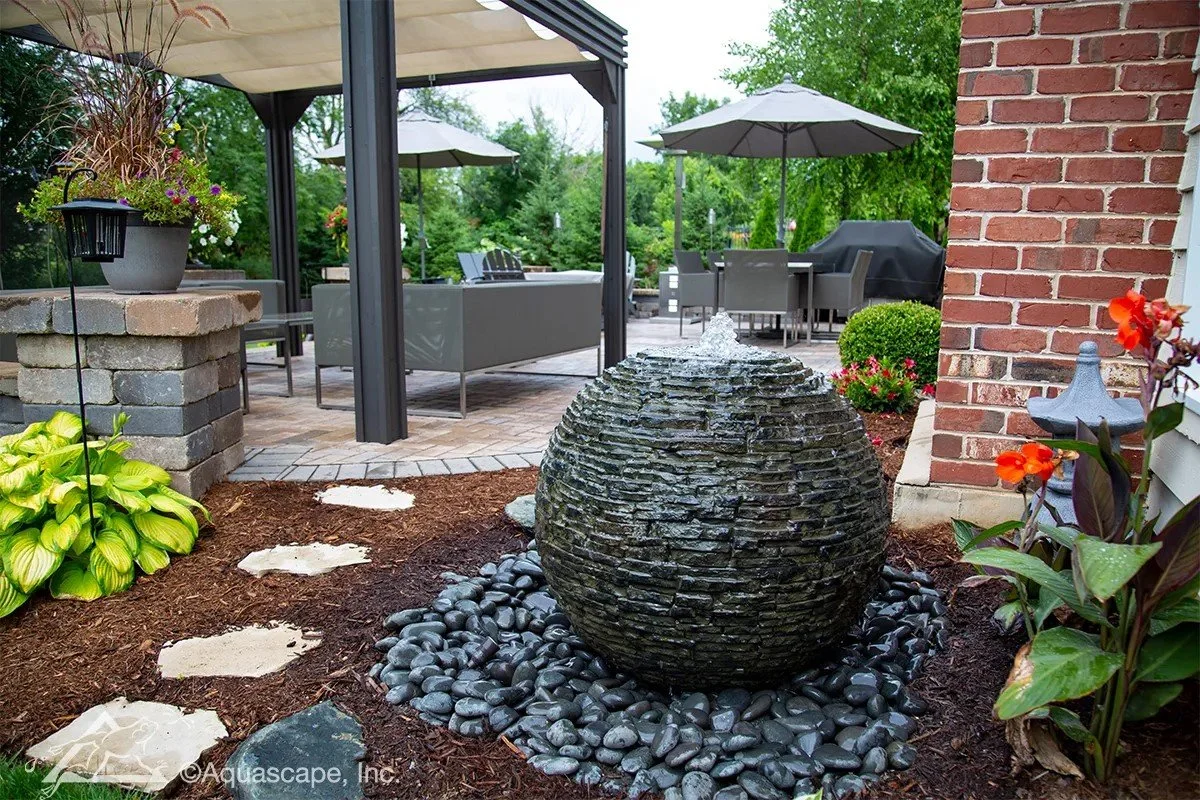 stacked slate fountain in backyard aquascape