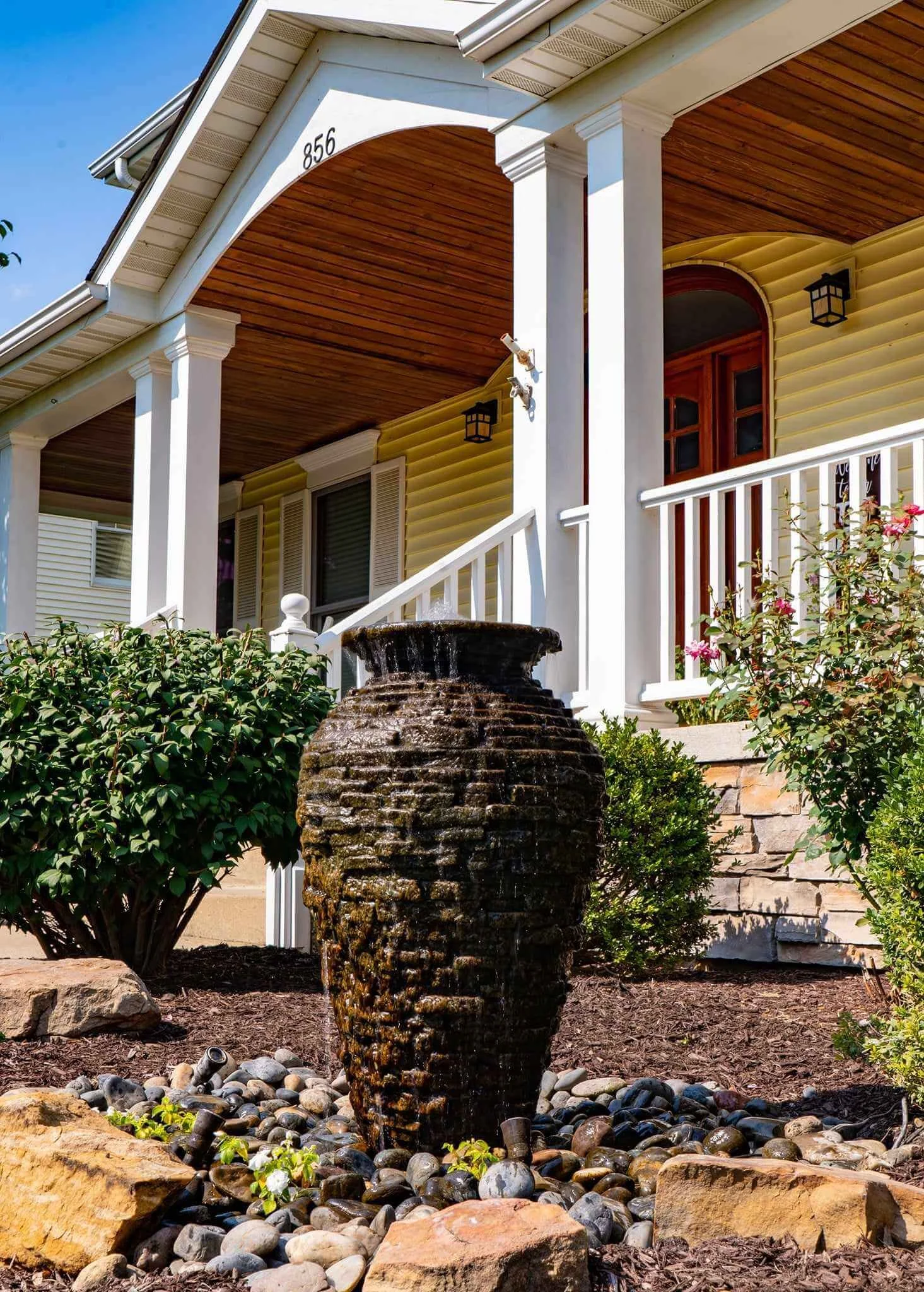 medium stacked slate urn water fountain in yard.jpg
