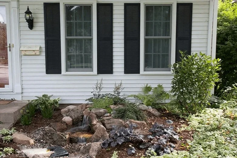 Small pondless waterfall in front yard entryway area