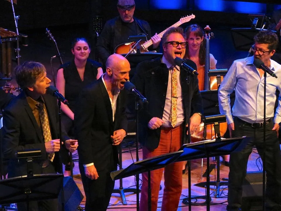  From left to right: Craig Northey , Carolyn Blackwell, John Mann, Rob Piltch, Steven Page, Amy Laing, Andy Maize   Photo by John Lauener 