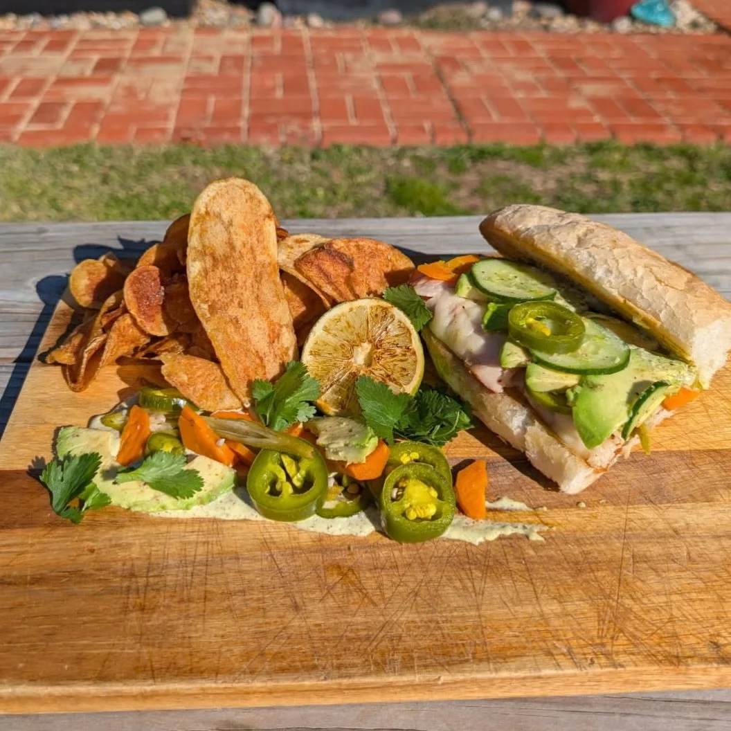 It&rsquo;s a fine day to pull up a seat outside and dig into our new hot lunch special. ☀️

Meet the Turkey Melt B&aacute;nh M&igrave;! Cajun turkey, melted white cheddar, cilantro-lime remoulade, pickled carrots, jalape&ntilde;o, okra, cucumber and 